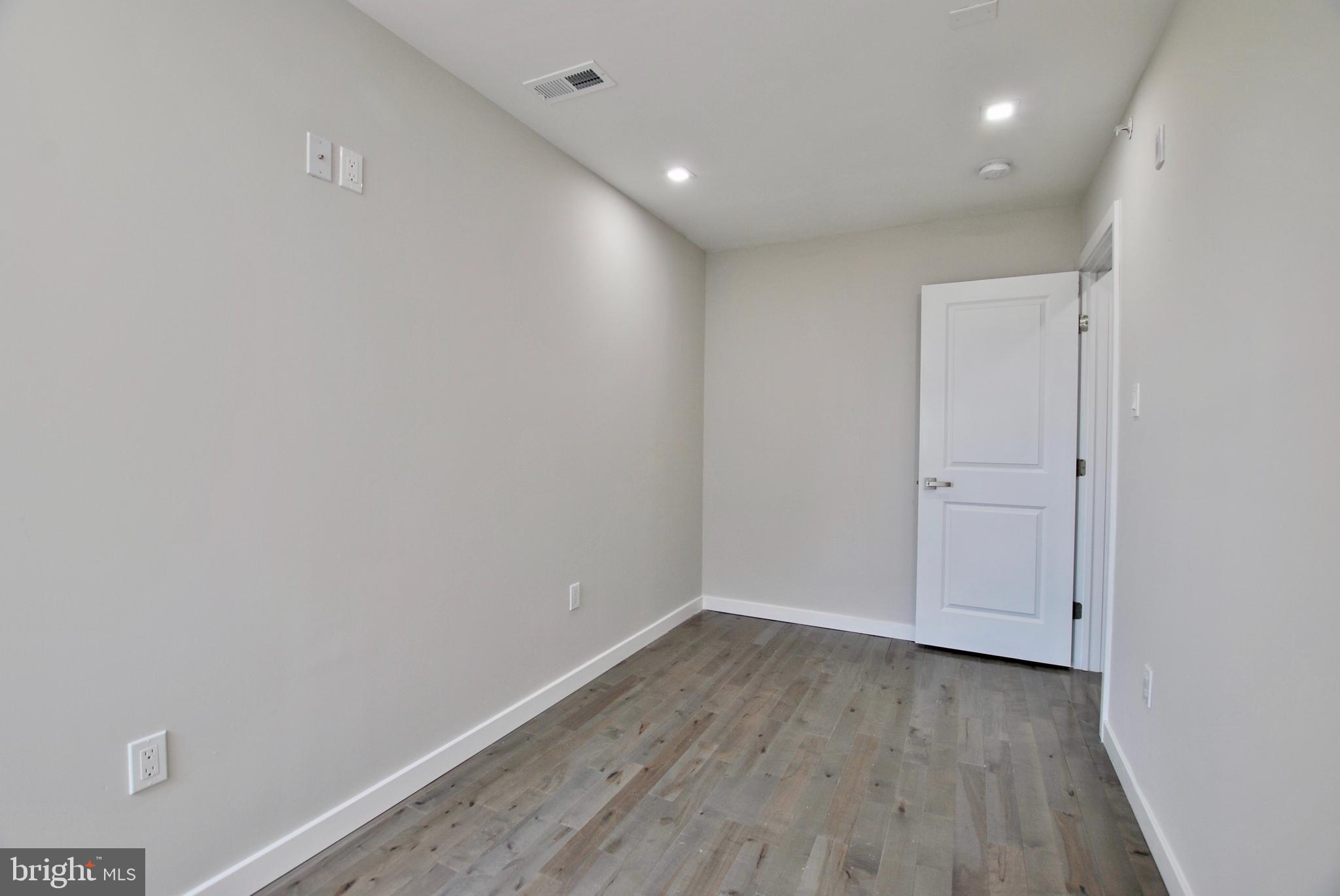 2153 North 19th Street, Unit 4 Philadelphia, PA 19121 - Photo 11 of 17 a view of a room with wooden floor