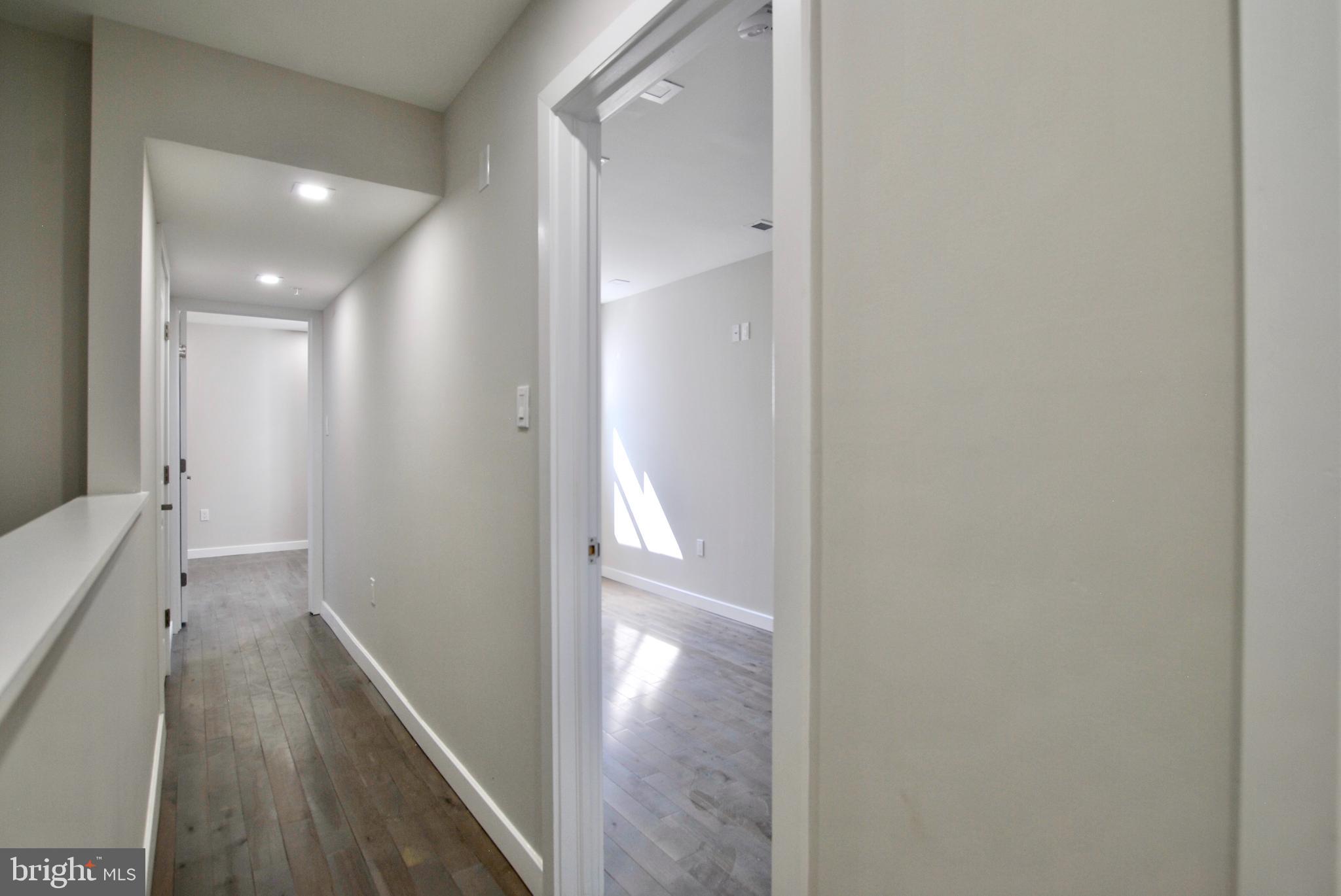 2153 North 19th Street, Unit 4 Philadelphia, PA 19121 - Photo 12 of 17 a view of a hallway with wooden floor