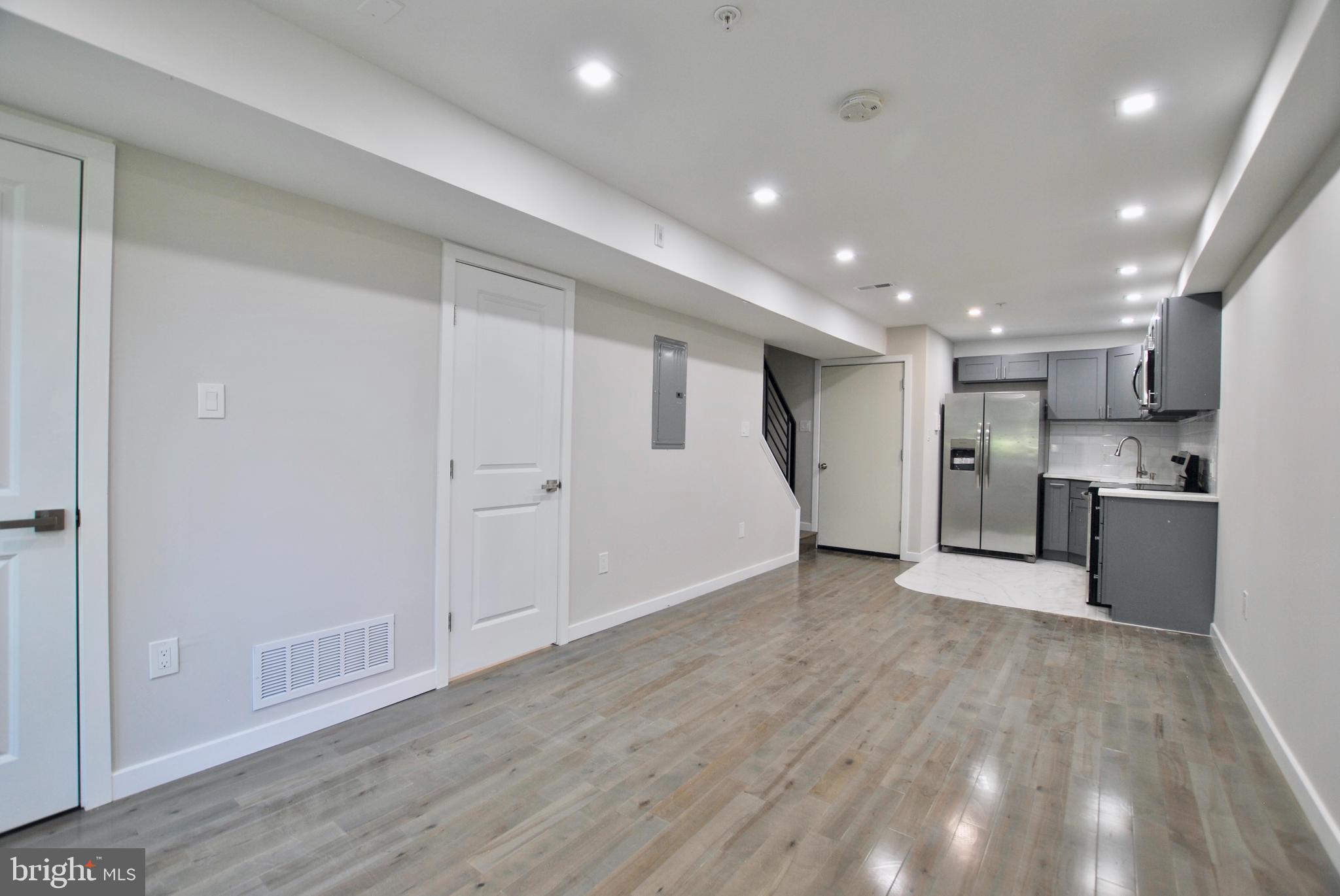 2153 North 19th Street, Unit 4 Philadelphia, PA 19121 - Photo 5 of 17 a view of an empty room with wooden floor