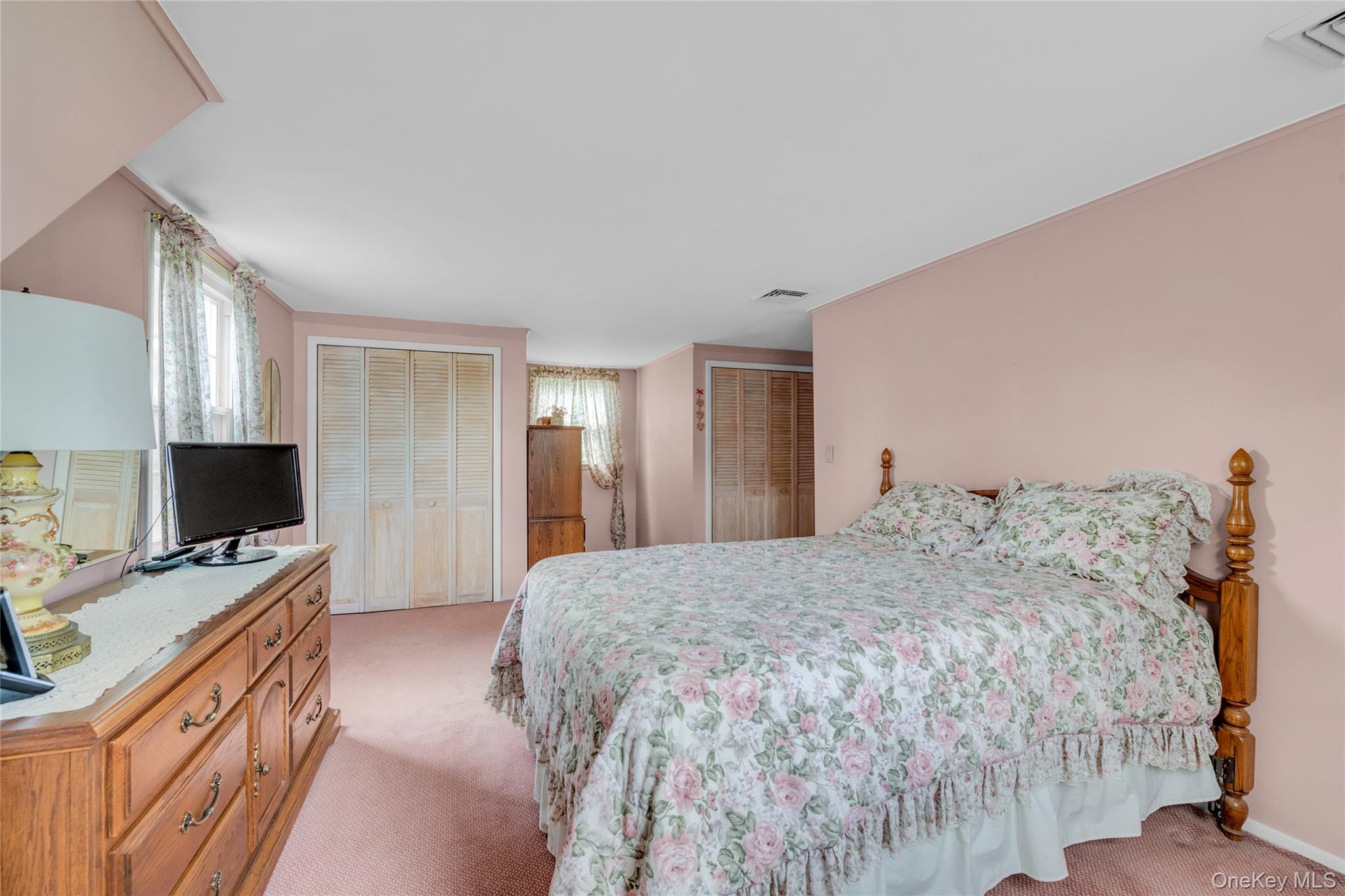 21 Farragut Road Old Bethpage, NY 11804 - Photo 16 of 22 Bedroom featuring multiple closets and light colored carpet