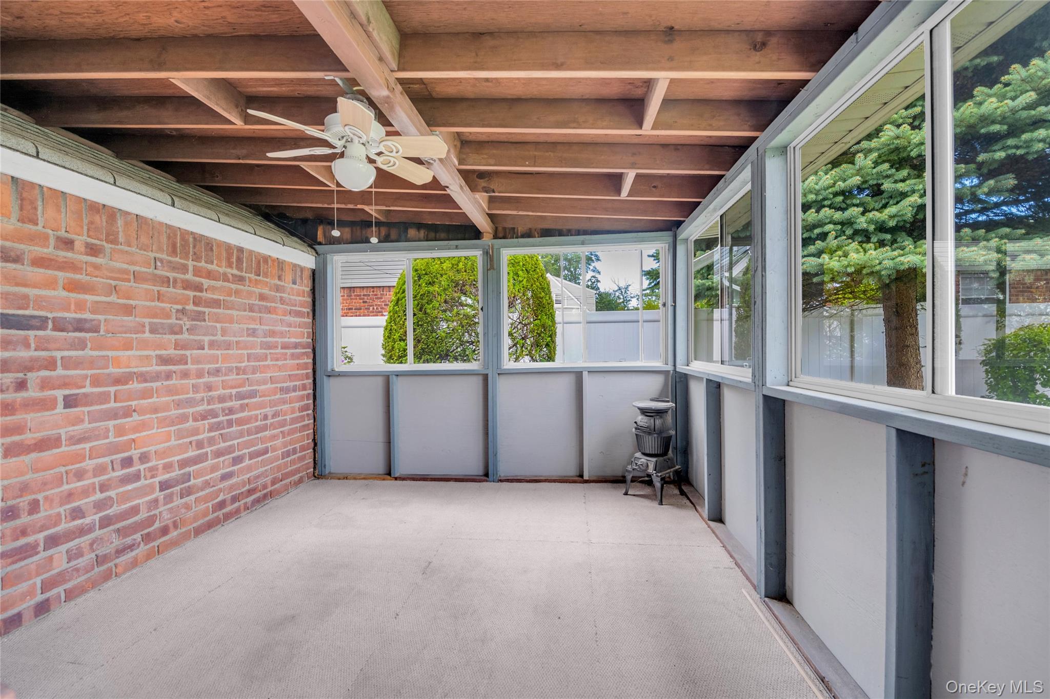 21 Farragut Road Old Bethpage, NY 11804 - Photo 9 of 22 Unfurnished sunroom with ceiling fan and lofted ceiling