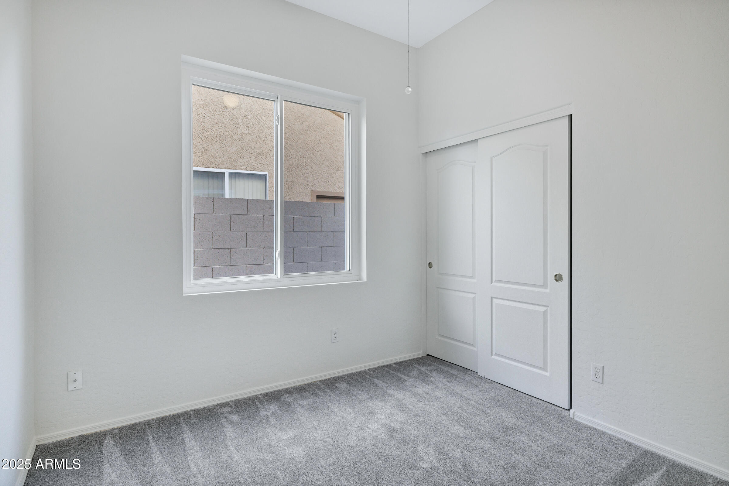 1403 West Windhaven Avenue Gilbert, AZ 85233 - Photo 23 of 64 an empty room with windows and closet