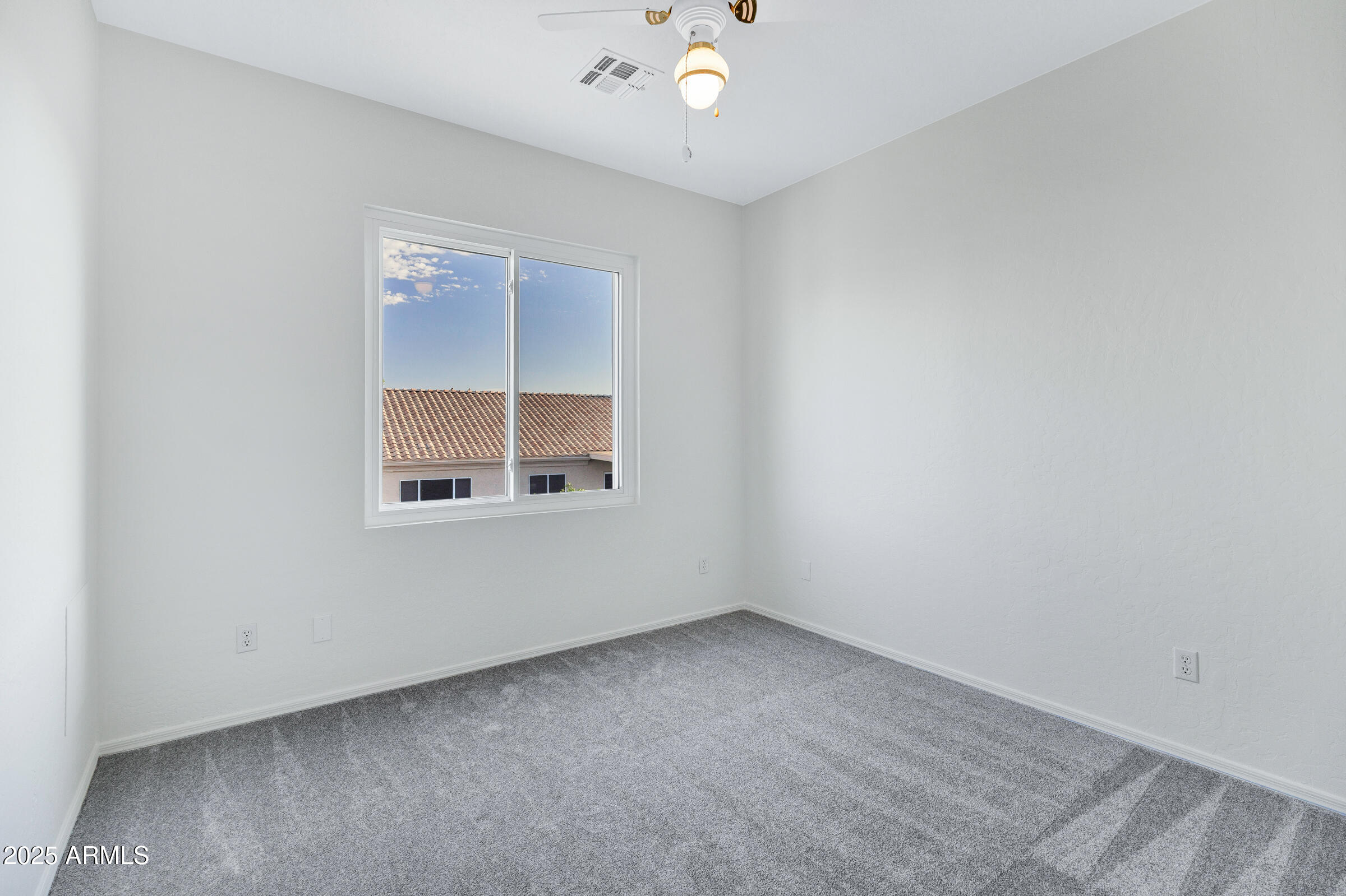 1403 West Windhaven Avenue Gilbert, AZ 85233 - Photo 27 of 64 an empty room with a window