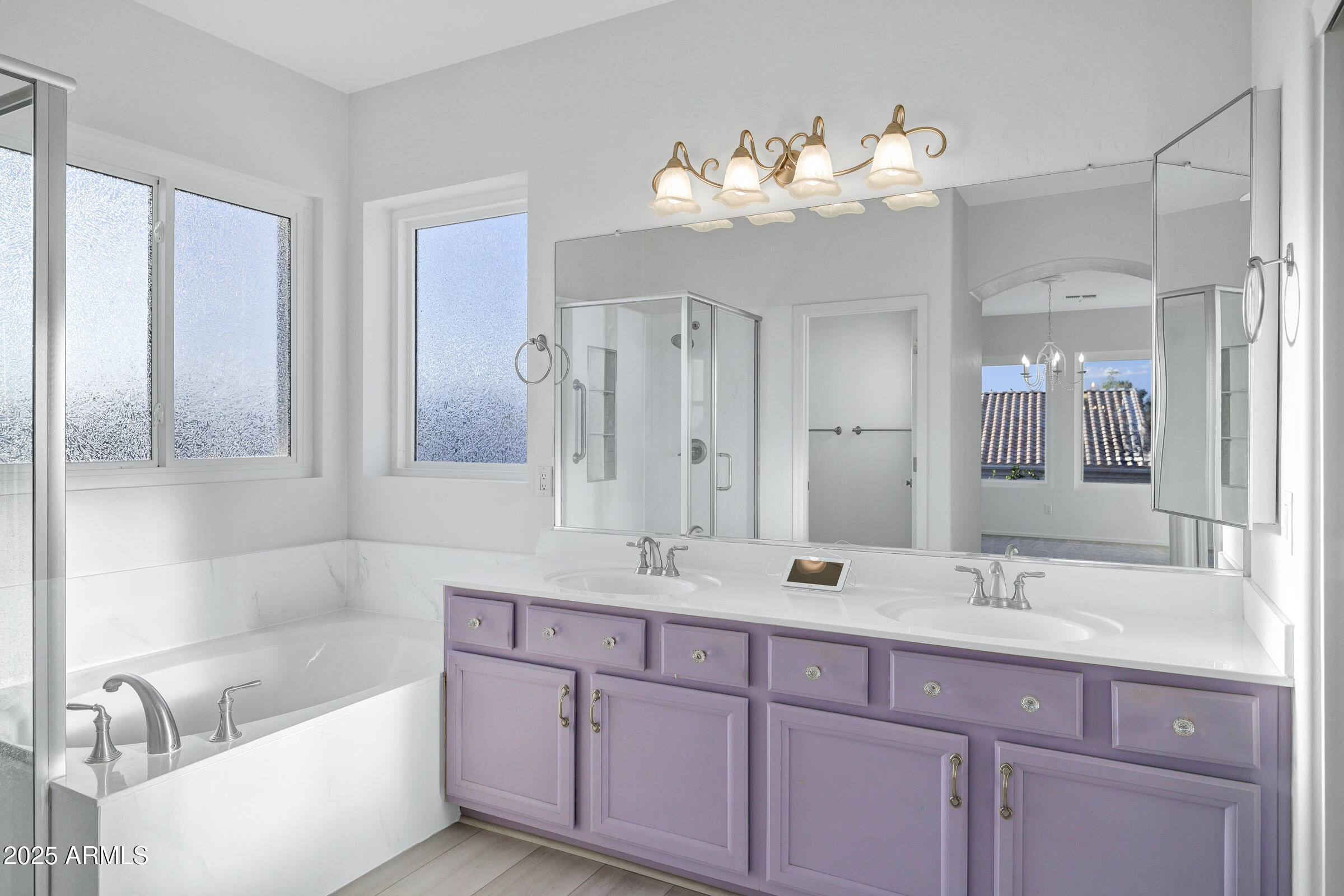 1403 West Windhaven Avenue Gilbert, AZ 85233 - Photo 32 of 64 a bathroom with a double vanity sink mirror and bathtub