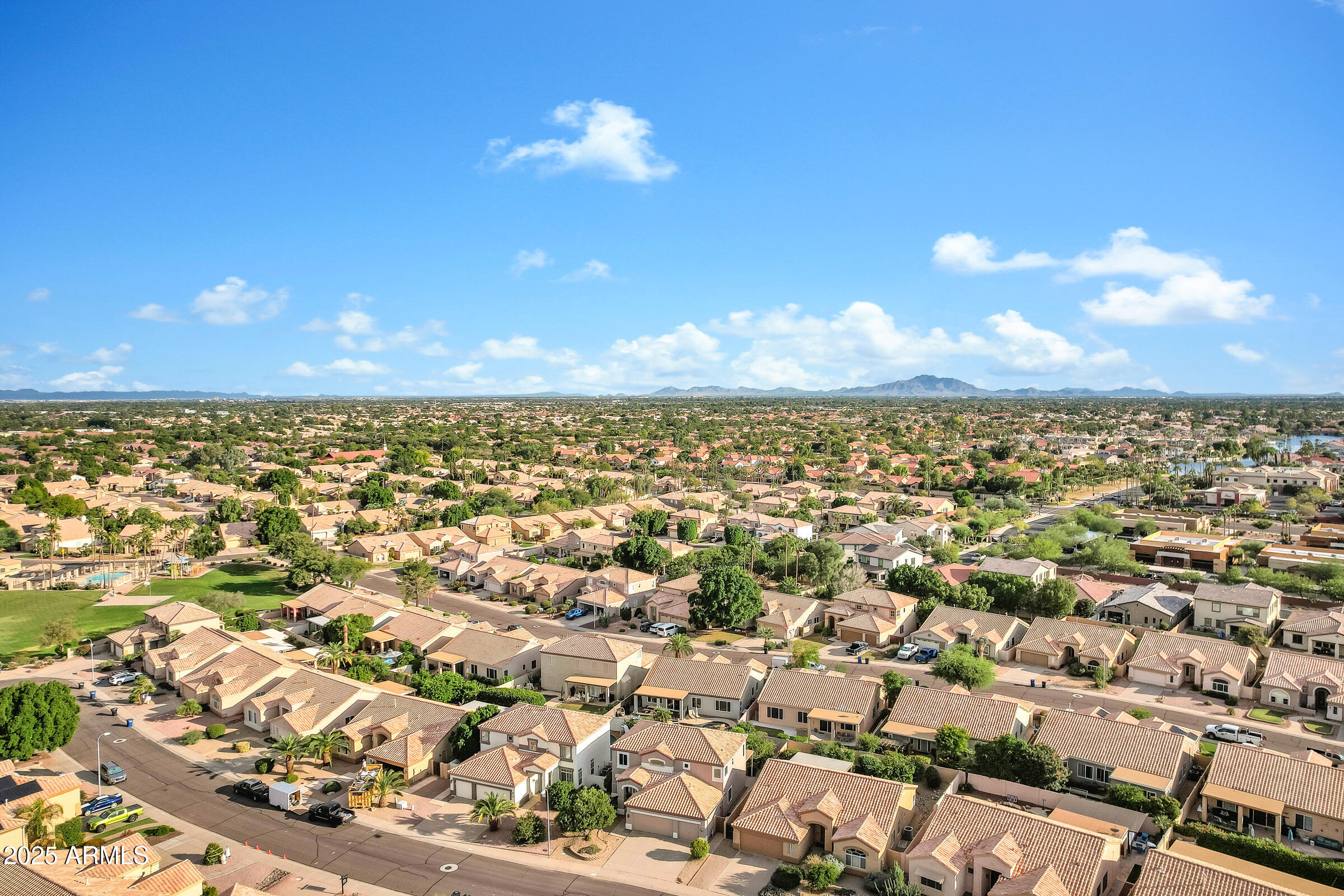 1403 West Windhaven Avenue Gilbert, AZ 85233 - Photo 47 of 64 an aerial view of residential building with outdoor space