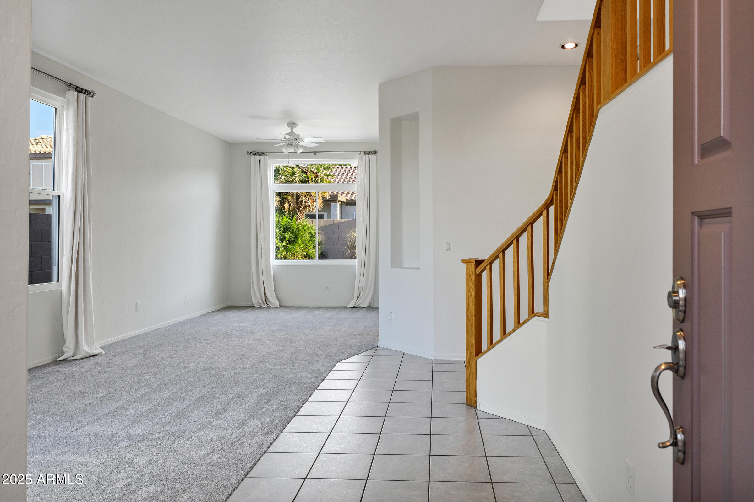 1403 West Windhaven Avenue Gilbert, AZ 85233 - Photo 5 of 64 a view of an entryway with staircase