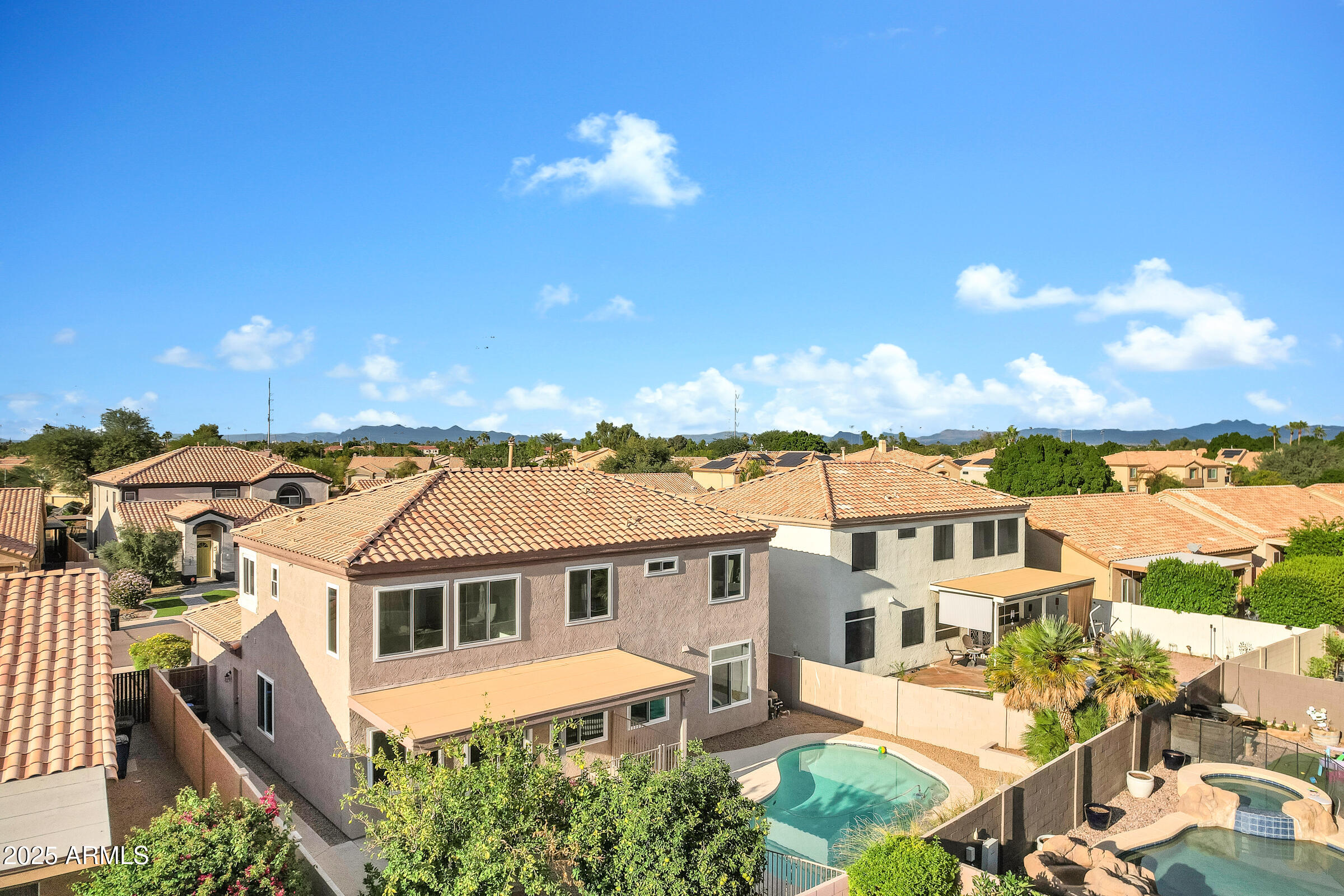 1403 West Windhaven Avenue Gilbert, AZ 85233 - Photo 56 of 64 a front view of a house with a yard