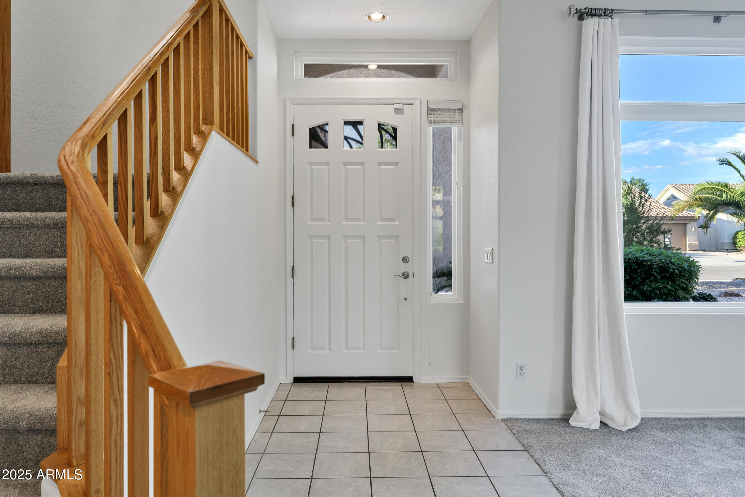 1403 West Windhaven Avenue Gilbert, AZ 85233 - Photo 6 of 64 a view of a hallway view with staircase