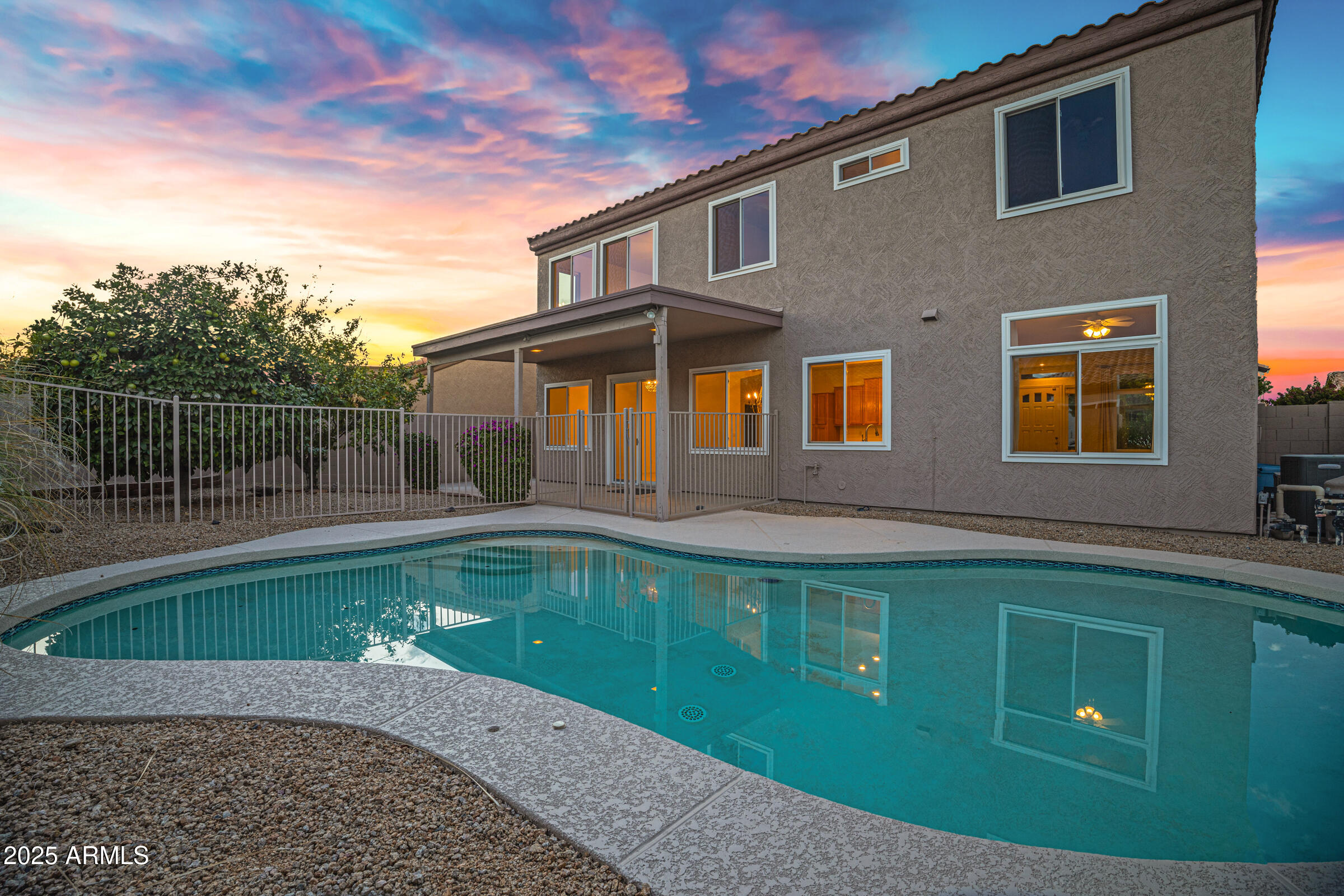 1403 West Windhaven Avenue Gilbert, AZ 85233 - Photo 61 of 64 a front view of a house with swimming pool
