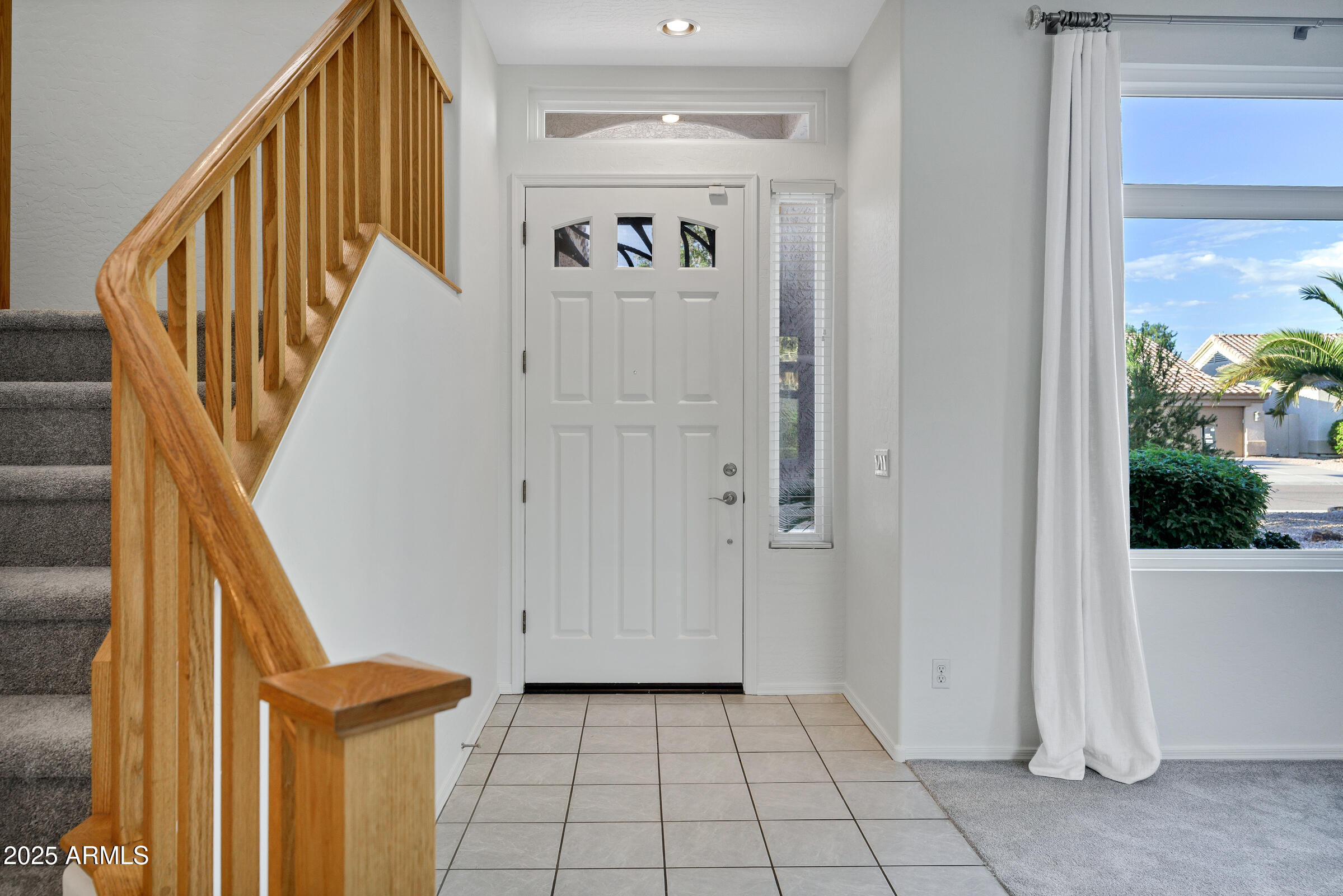 1403 West Windhaven Avenue Gilbert, AZ 85233 - Photo 7 of 64 a view of a hallway with wooden floor and staircase