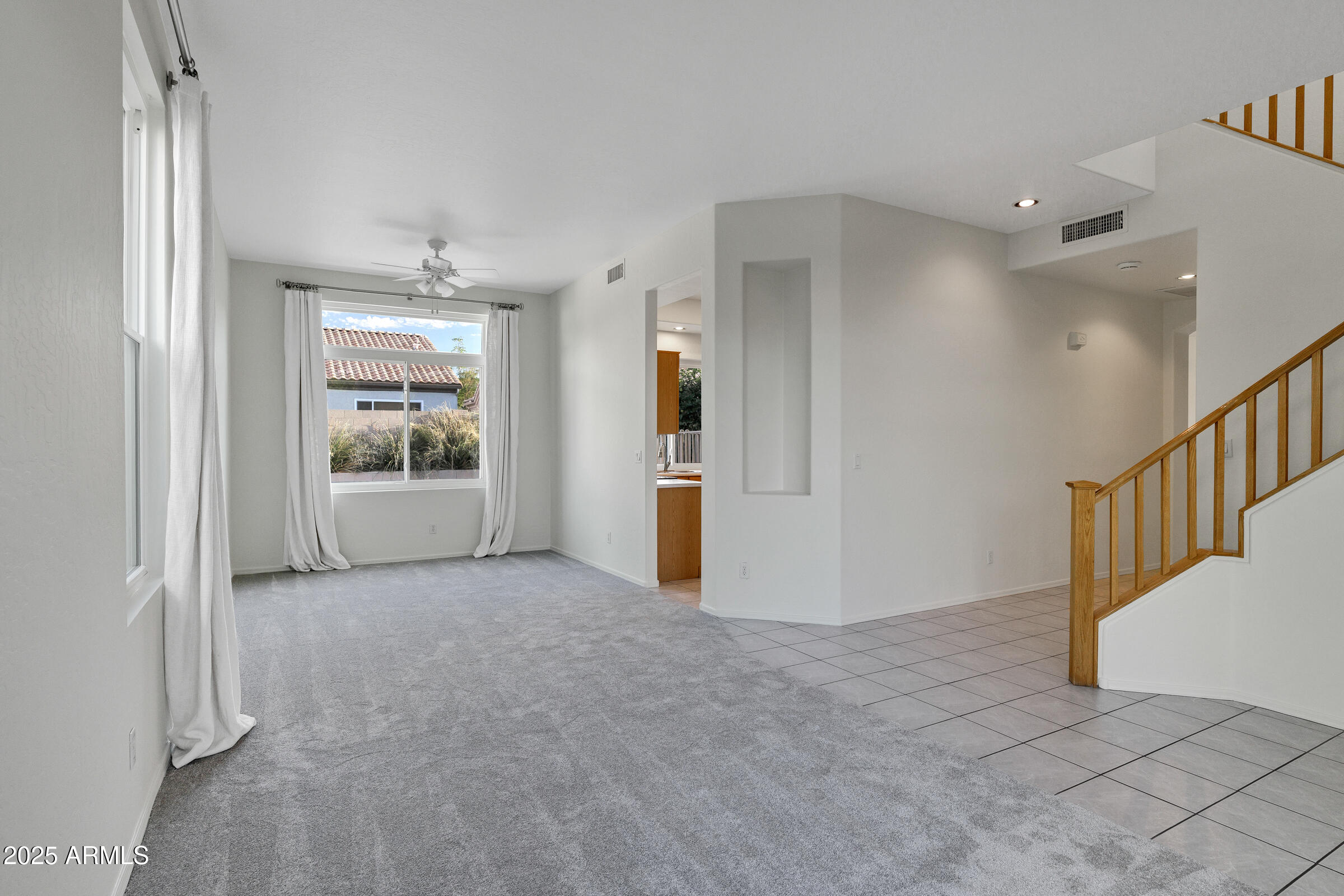 1403 West Windhaven Avenue Gilbert, AZ 85233 - Photo 9 of 64 en view interior of a house with wooden floor and windows