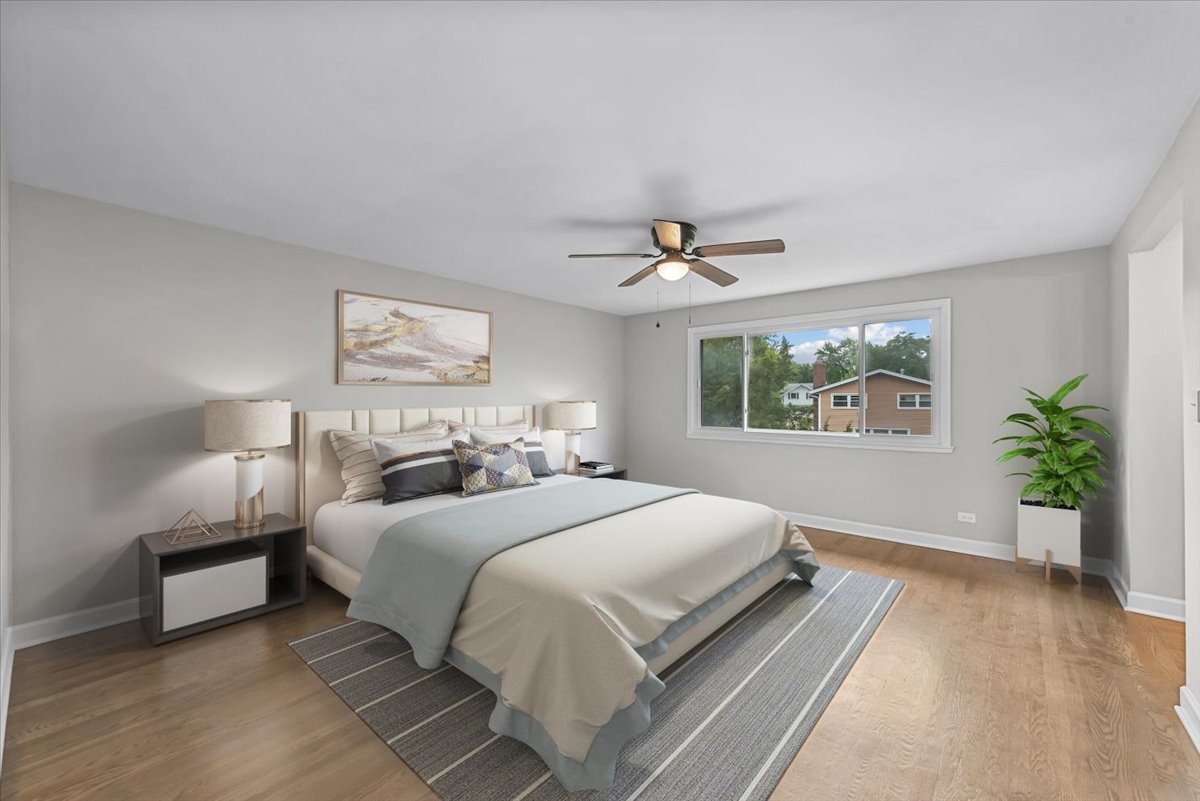 415 Laconia Court Schaumburg, IL 60193 - Photo 19 of 36 a bedroom with a large bed and a window