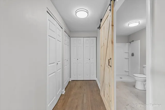 a view of a bathroom from a hallway