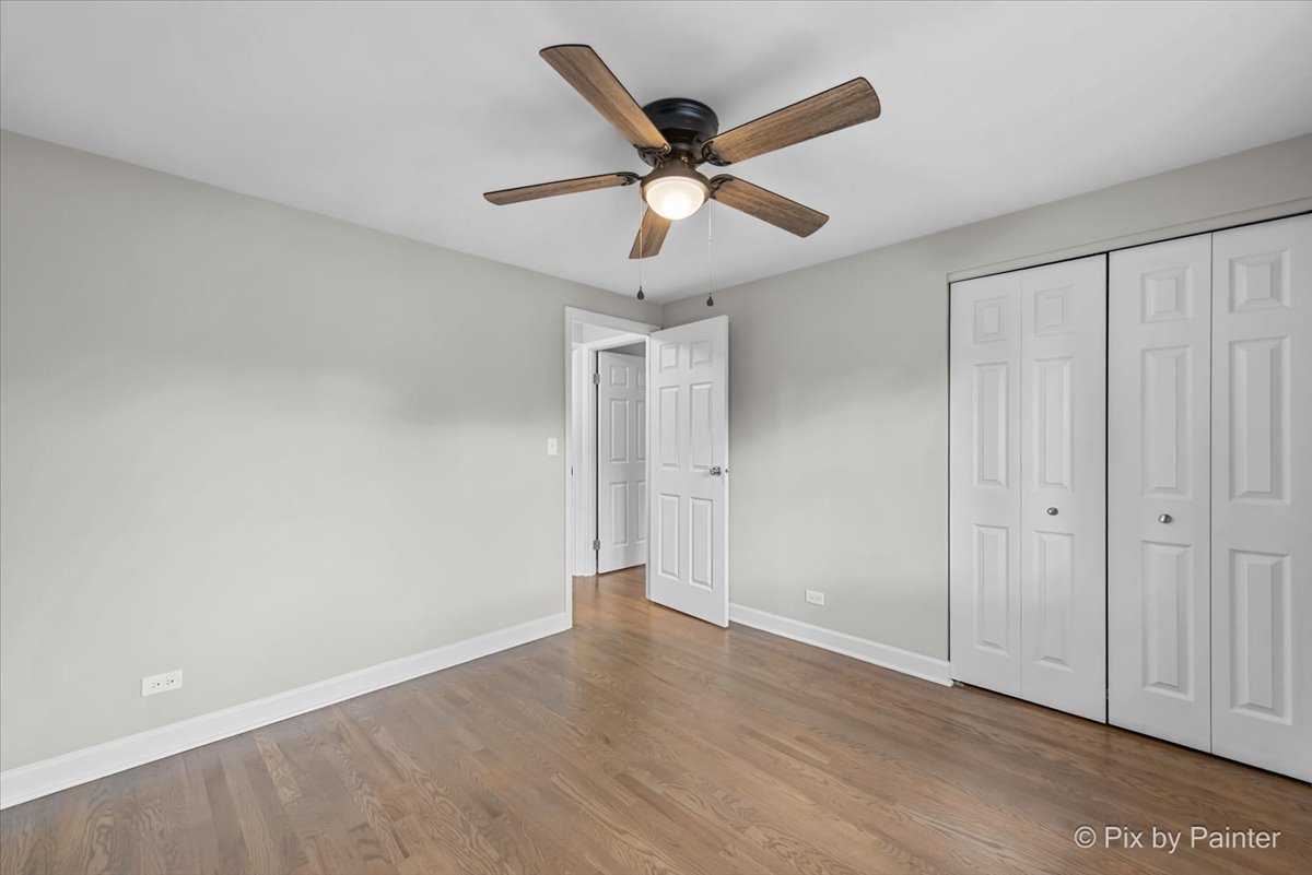 415 Laconia Court Schaumburg, IL 60193 - Photo 27 of 36 a view of an empty room with wooden floor