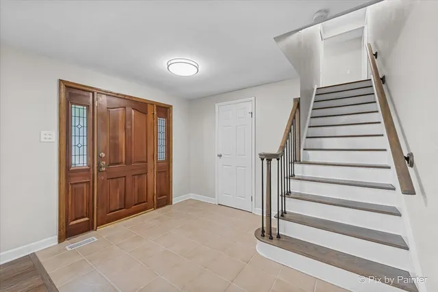 a view of entryway with stairs