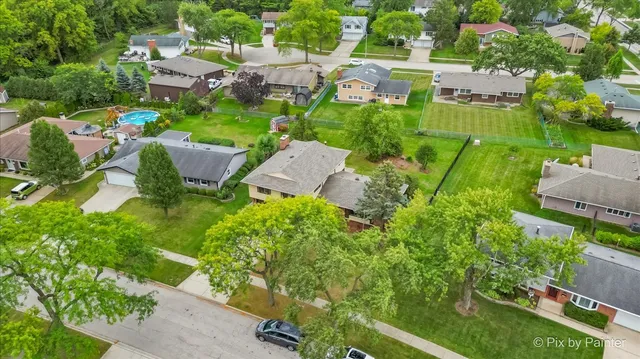 an aerial view of a house with a garden