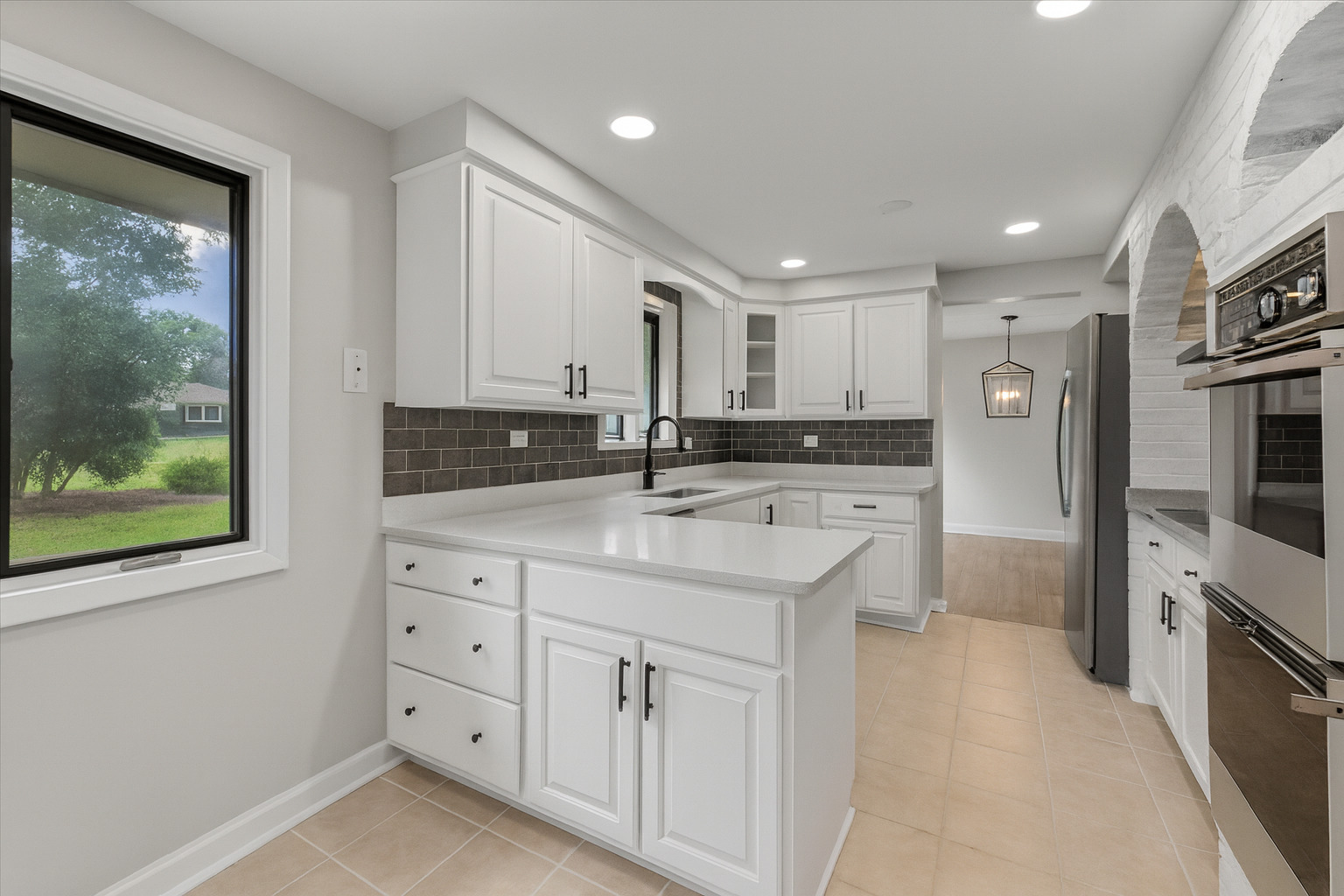 415 Laconia Court Schaumburg, IL 60193 - Photo 10 of 36 a kitchen with granite countertop a sink stainless steel appliances and cabinets