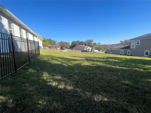 a view of a lake with a big yard
