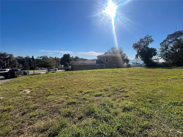 a view of a big yard with a house
