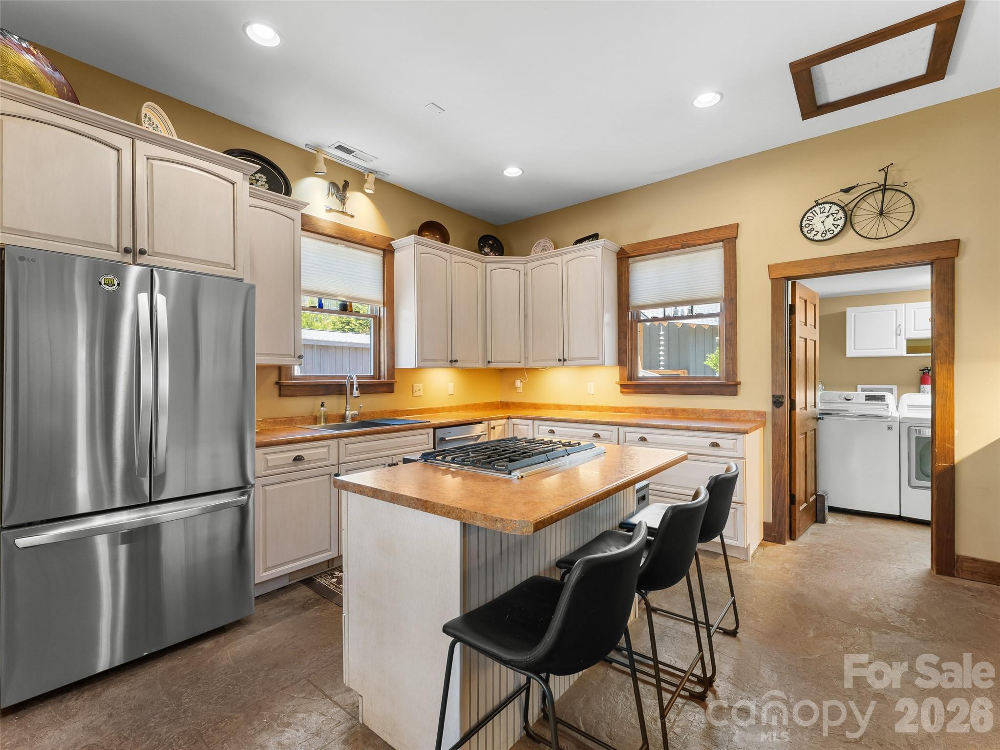 60 West Morgan Street Brevard, NC 28712 - Photo 13 of 48 a kitchen with stainless steel appliances granite countertop a stove refrigerator sink and cabinets