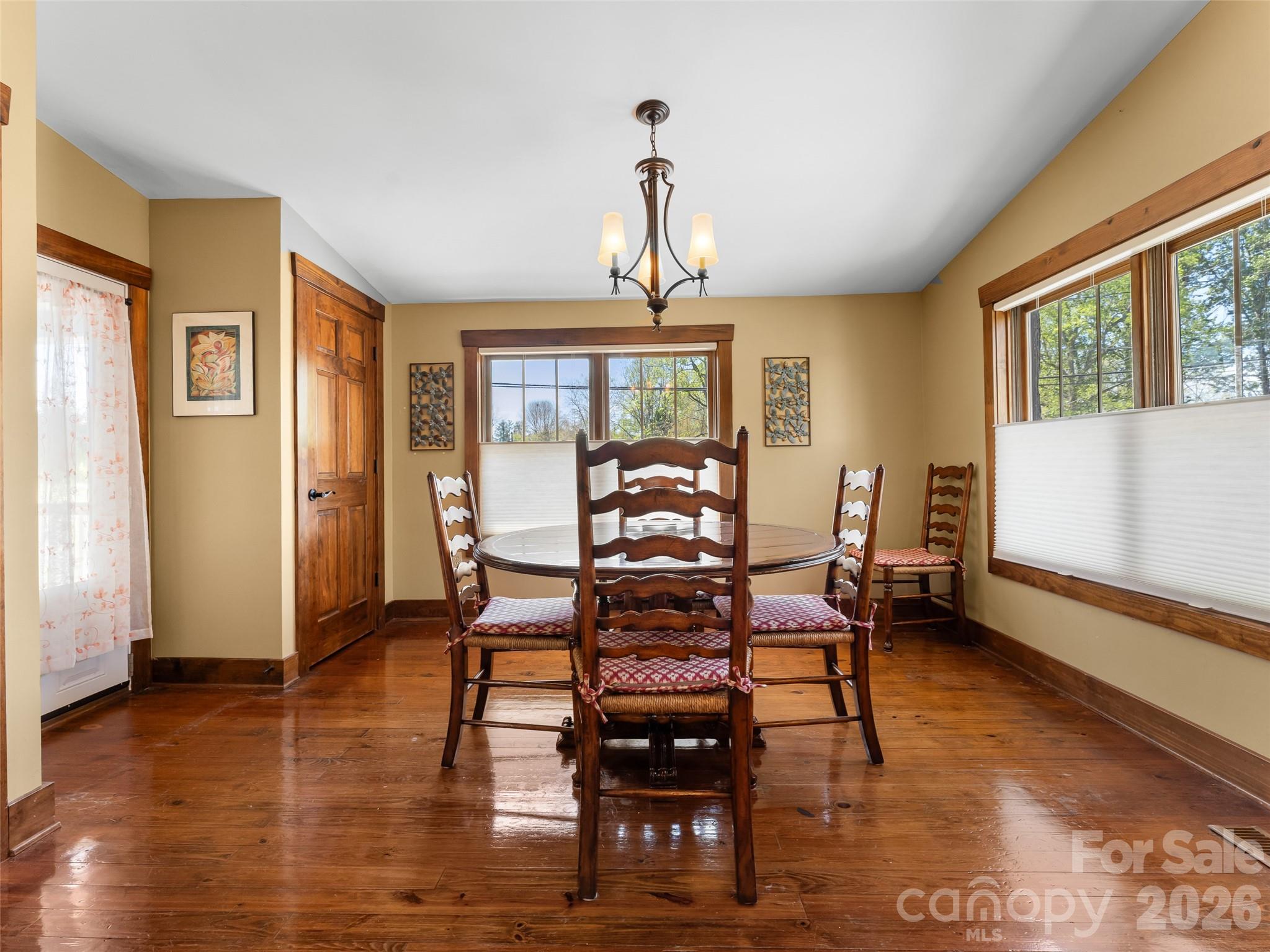 60 West Morgan Street Brevard, NC 28712 - Photo 15 of 48 a view of a dining room with furniture window and wooden floor