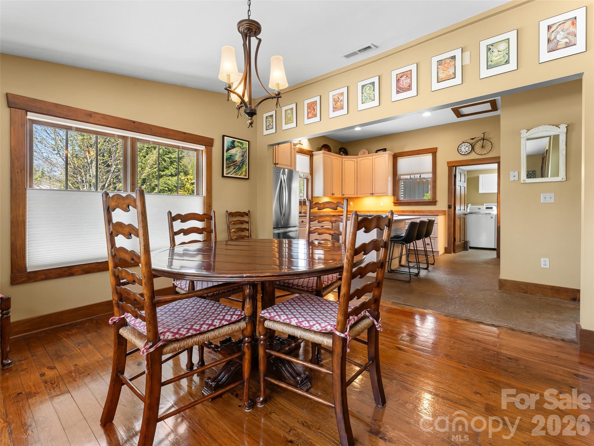 60 West Morgan Street Brevard, NC 28712 - Photo 16 of 48 a view of a dining room with furniture window and wooden floor