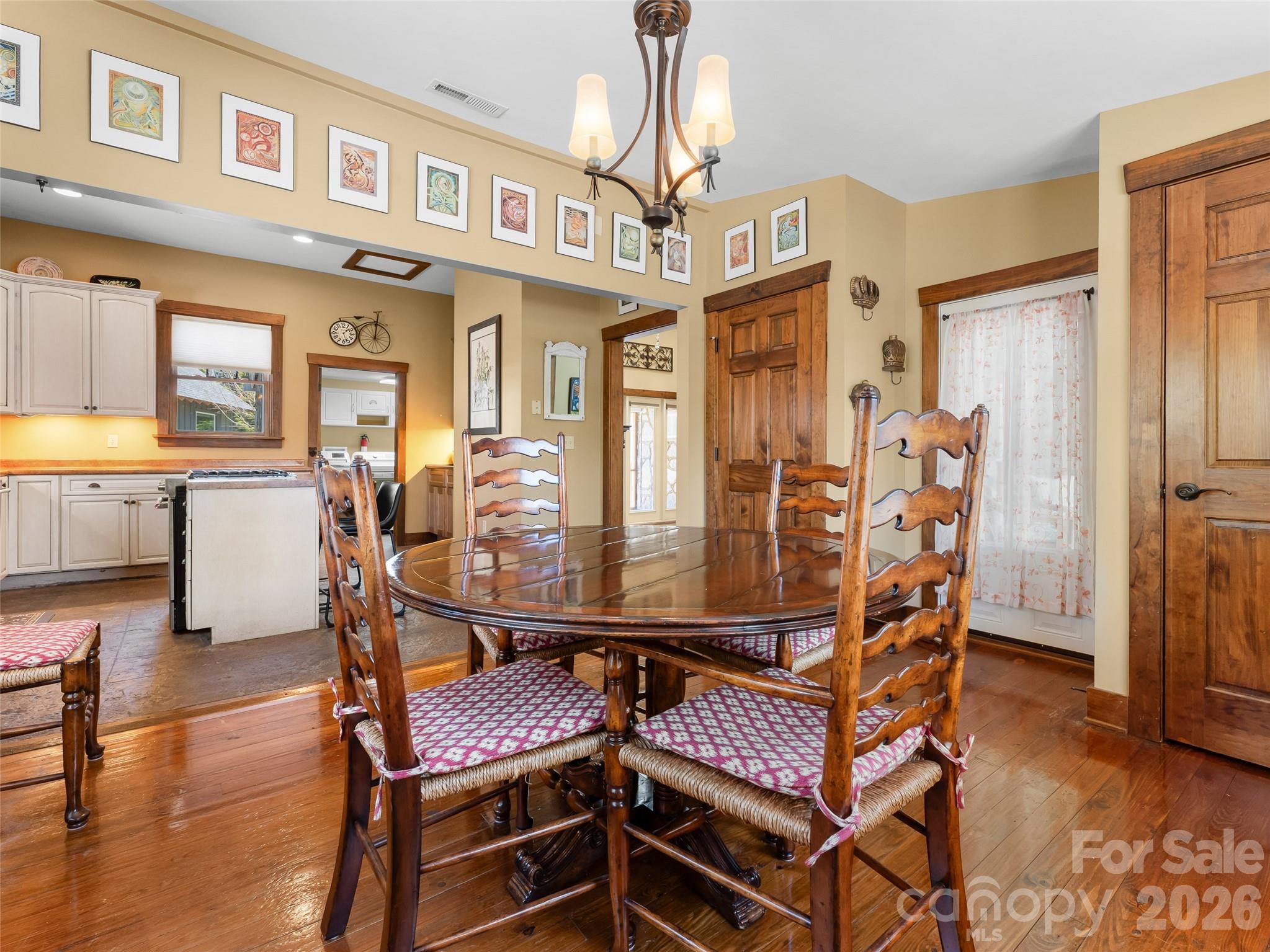 60 West Morgan Street Brevard, NC 28712 - Photo 17 of 48 a view of a dining room with furniture and wooden floor