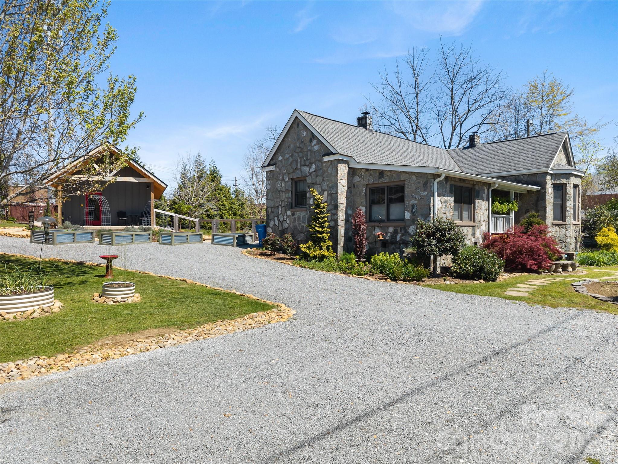 60 West Morgan Street Brevard, NC 28712 - Photo 2 of 48 a front view of house with yard and outdoor seating