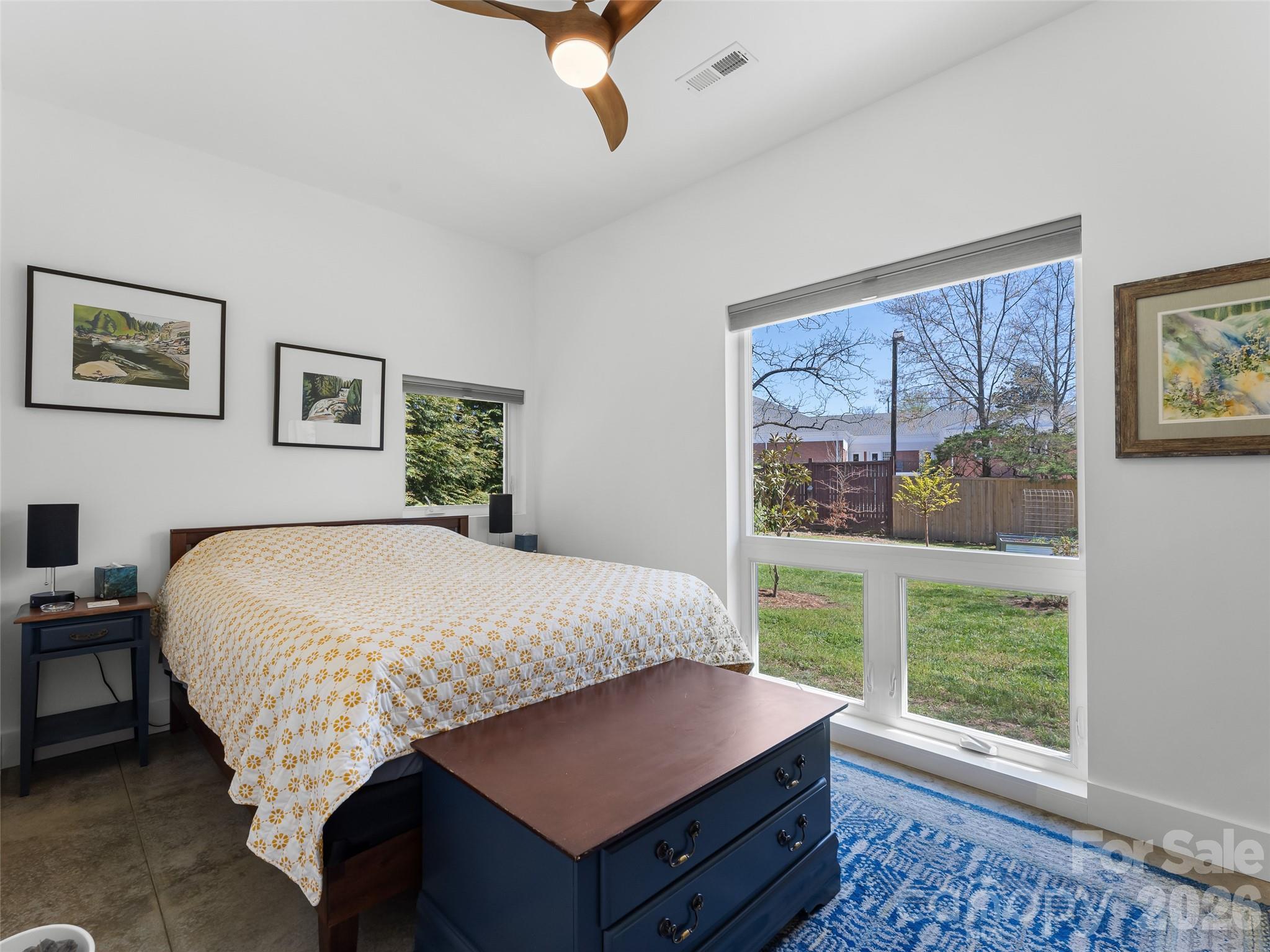 60 West Morgan Street Brevard, NC 28712 - Photo 42 of 48 a bedroom with a large bed and a window
