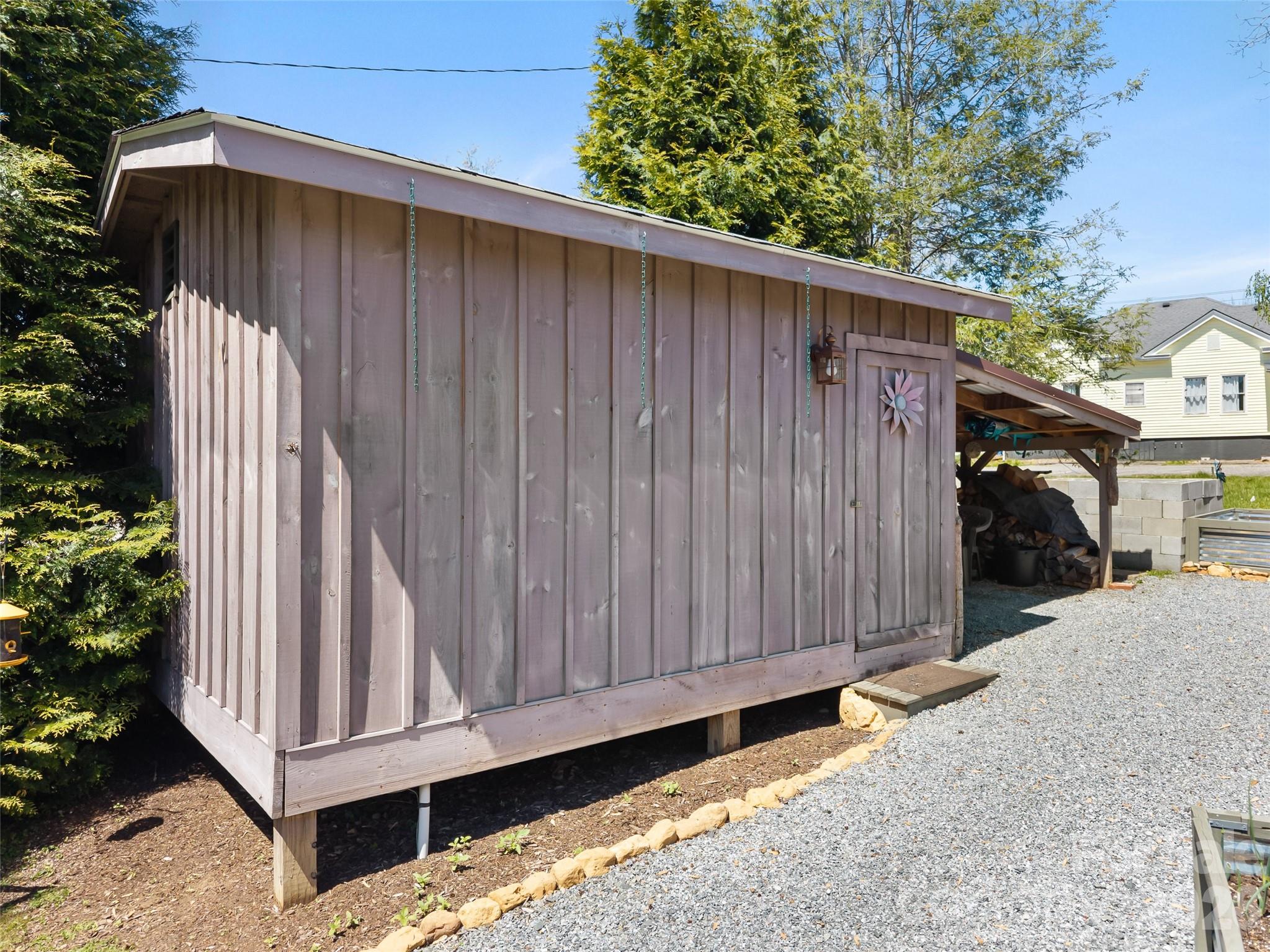 60 West Morgan Street Brevard, NC 28712 - Photo 46 of 48 a view of a house with a wooden fence