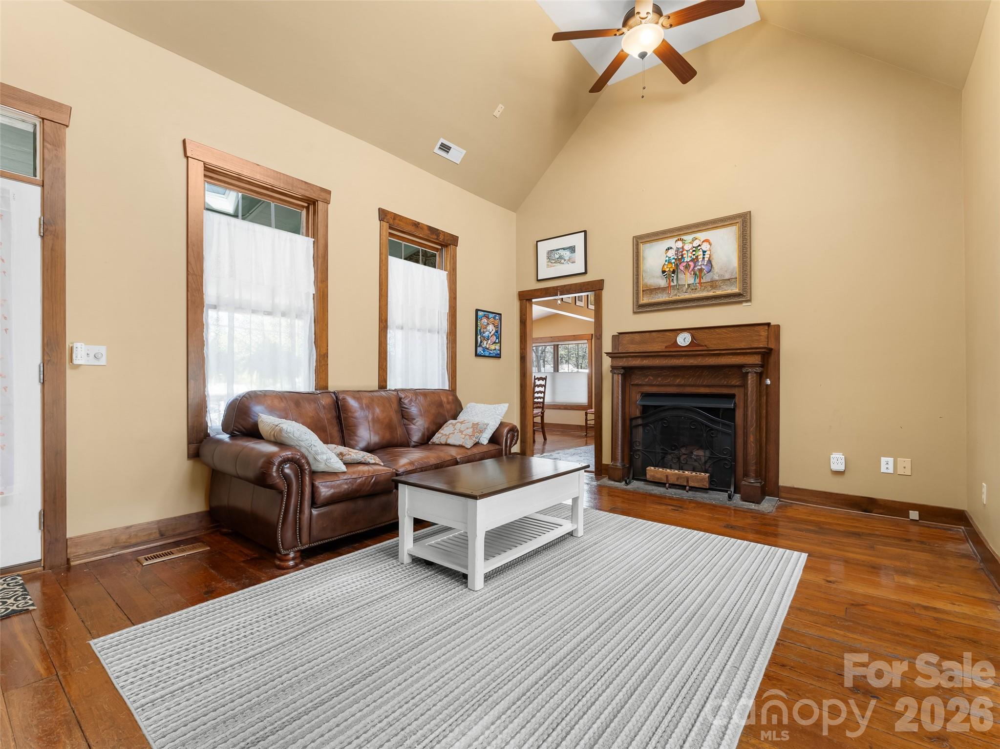 60 West Morgan Street Brevard, NC 28712 - Photo 10 of 48 a living room with furniture and a fireplace