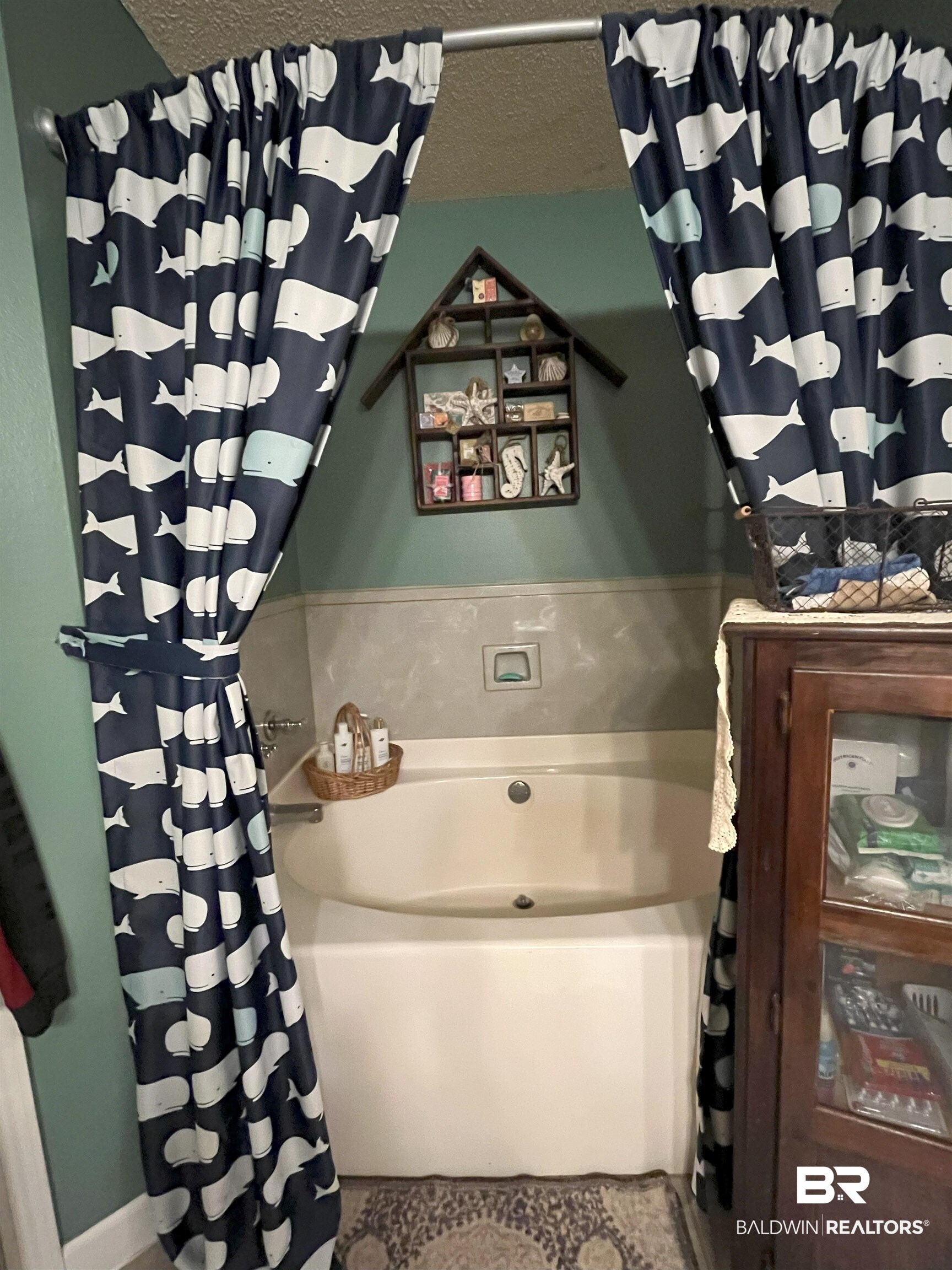 7851 Highway 98 Fairhope, AL 36532 - Photo 26 of 40 Bathroom with a garden tub, a textured ceiling, and tile patterned floors