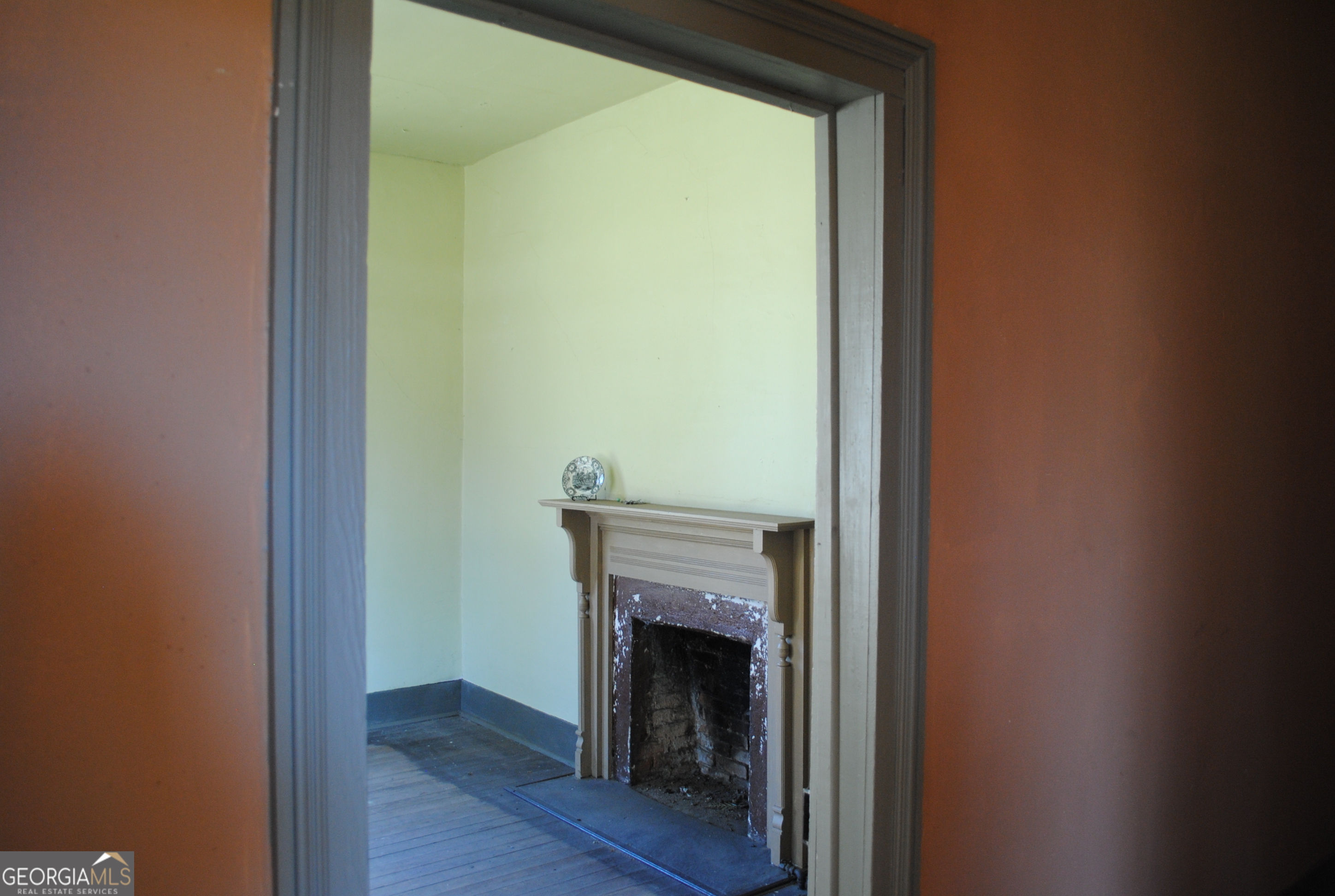 9822 Jones Street Sparta, GA 31087 - Photo 11 of 52 a view of a livingroom with a fireplace