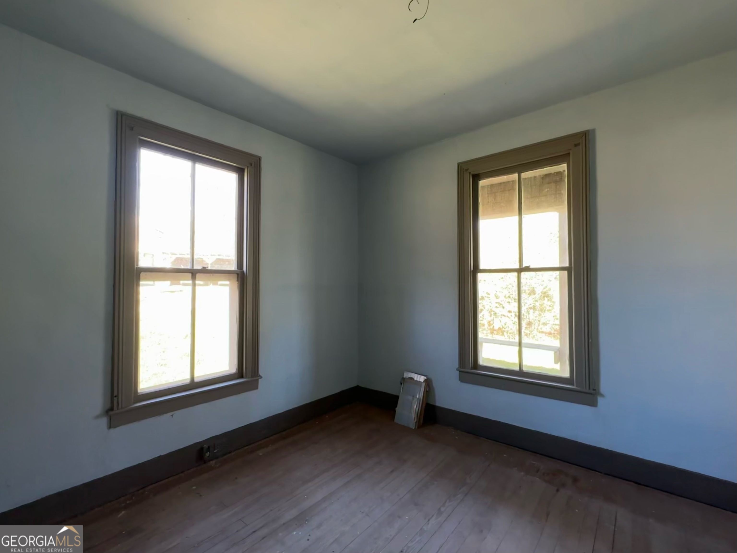 9822 Jones Street Sparta, GA 31087 - Photo 17 of 52 a view of an empty room with a window
