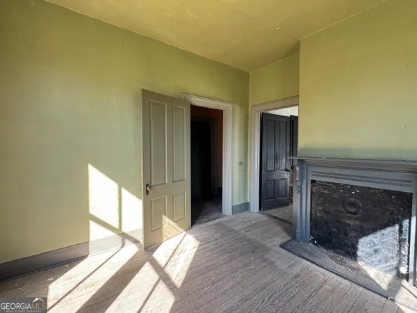 a room with a bed and window