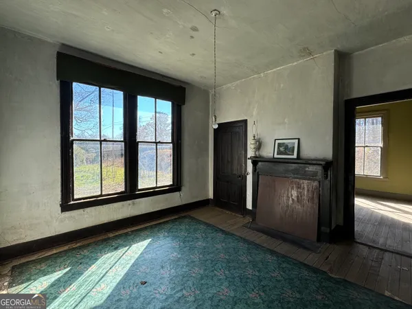wooden floor and window in an empty room