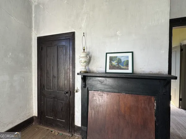 a view of a livingroom with wooden floor and a window