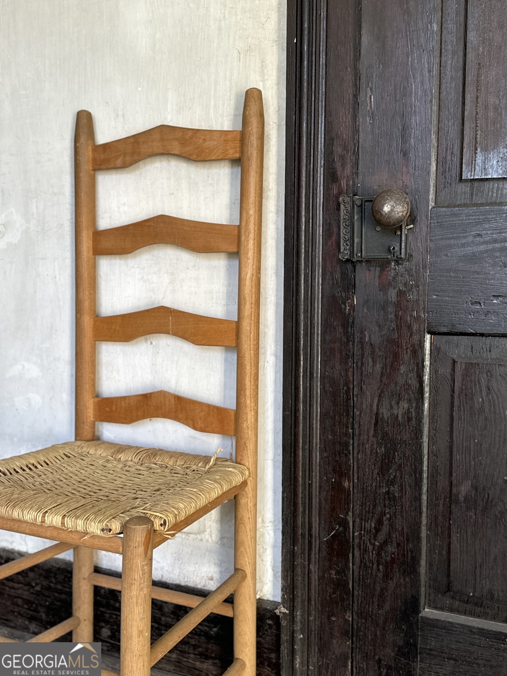 9822 Jones Street Sparta, GA 31087 - Photo 34 of 52 a view of a bedroom with a balcony and furniture