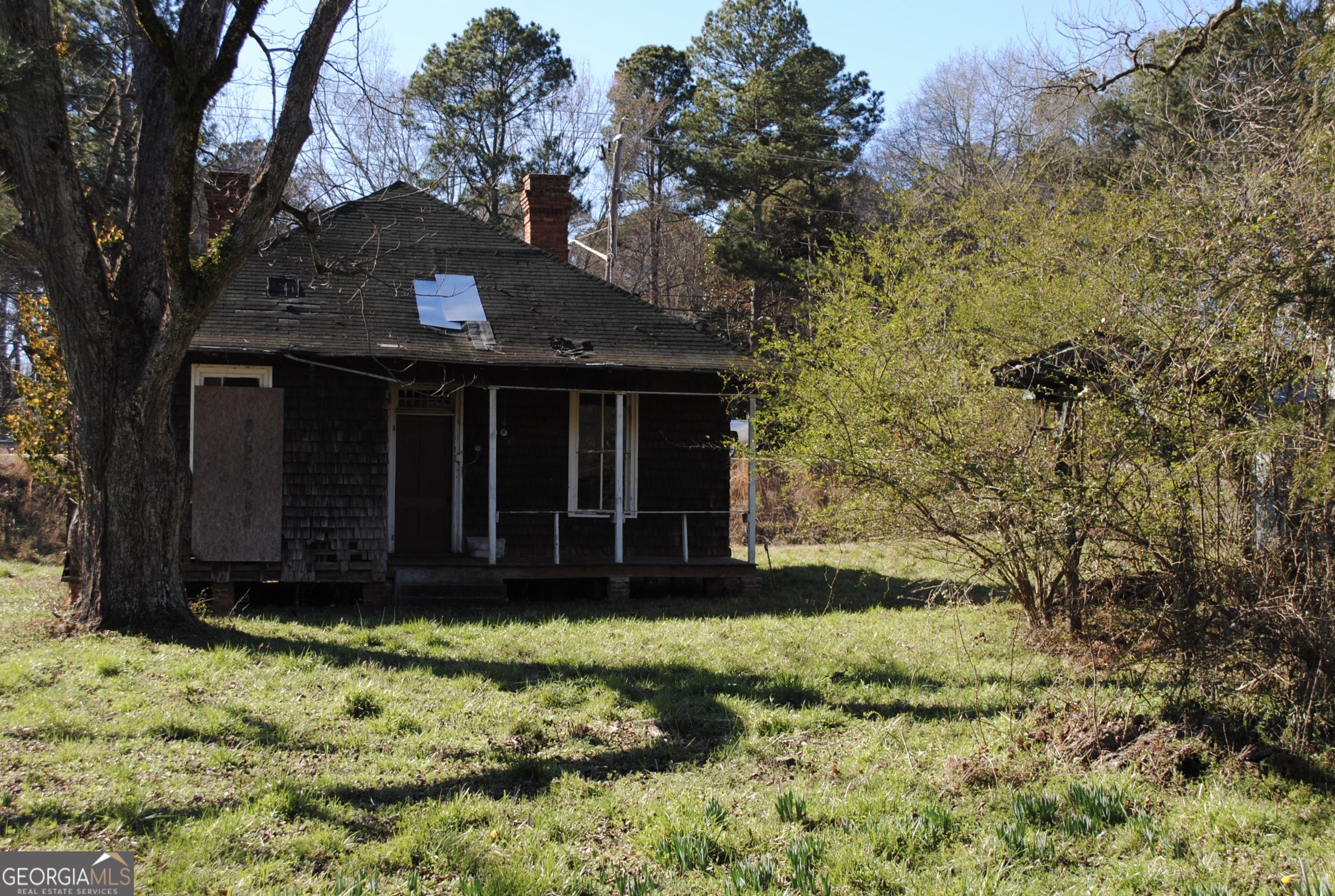 9822 Jones Street Sparta, GA 31087 - Photo 36 of 52 a view of a house with a yard