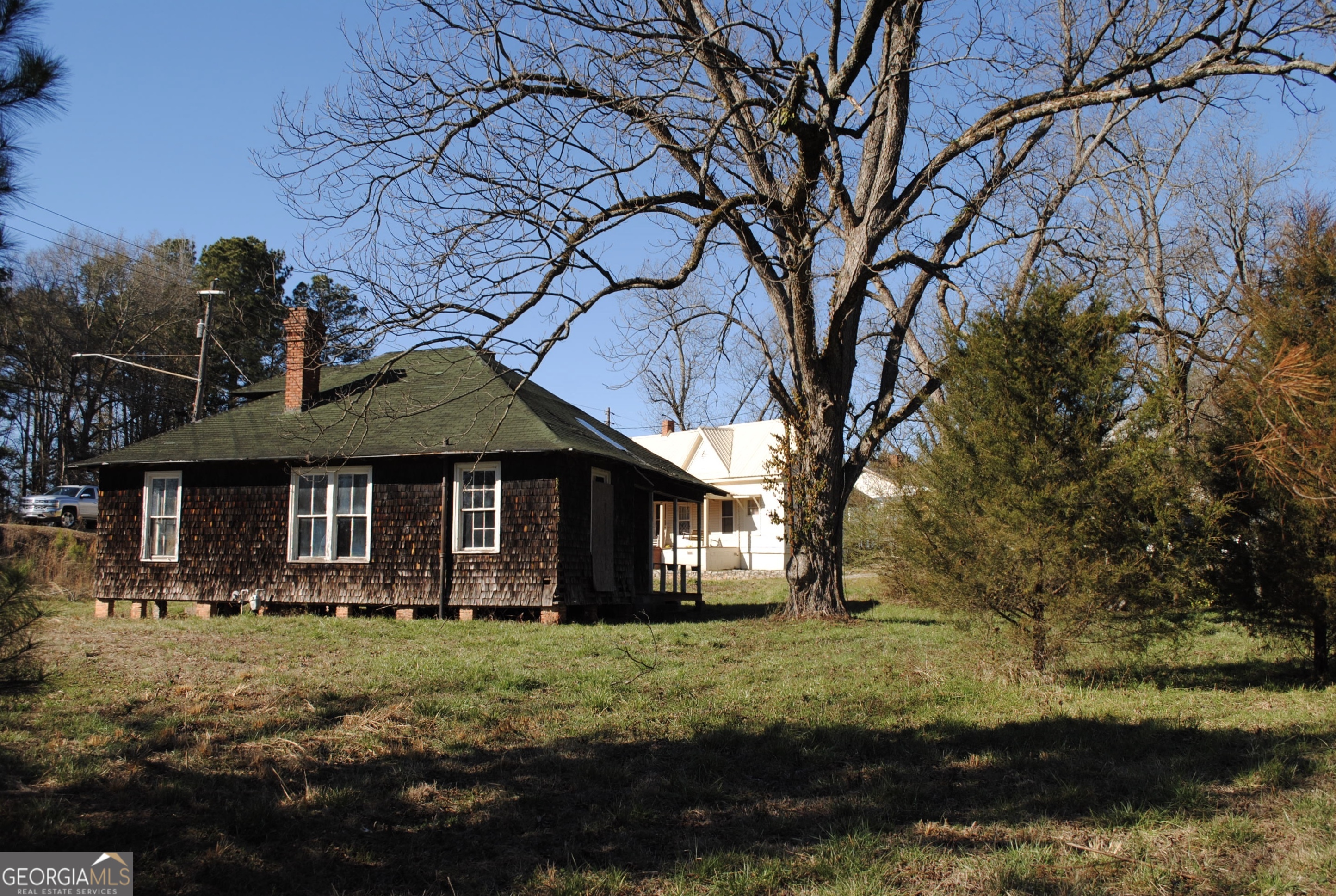 9822 Jones Street Sparta, GA 31087 - Photo 38 of 52 a front view of a house with garden