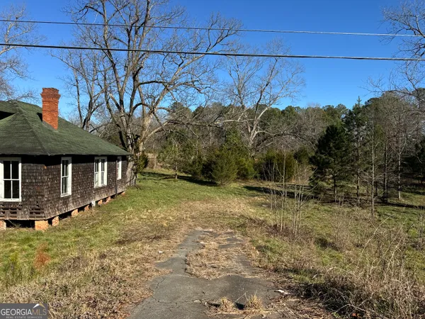 a view of a street with a building in the background