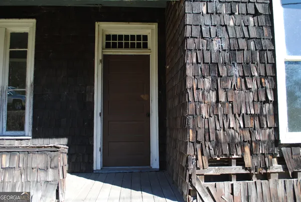 a view of a balcony with wooden floor