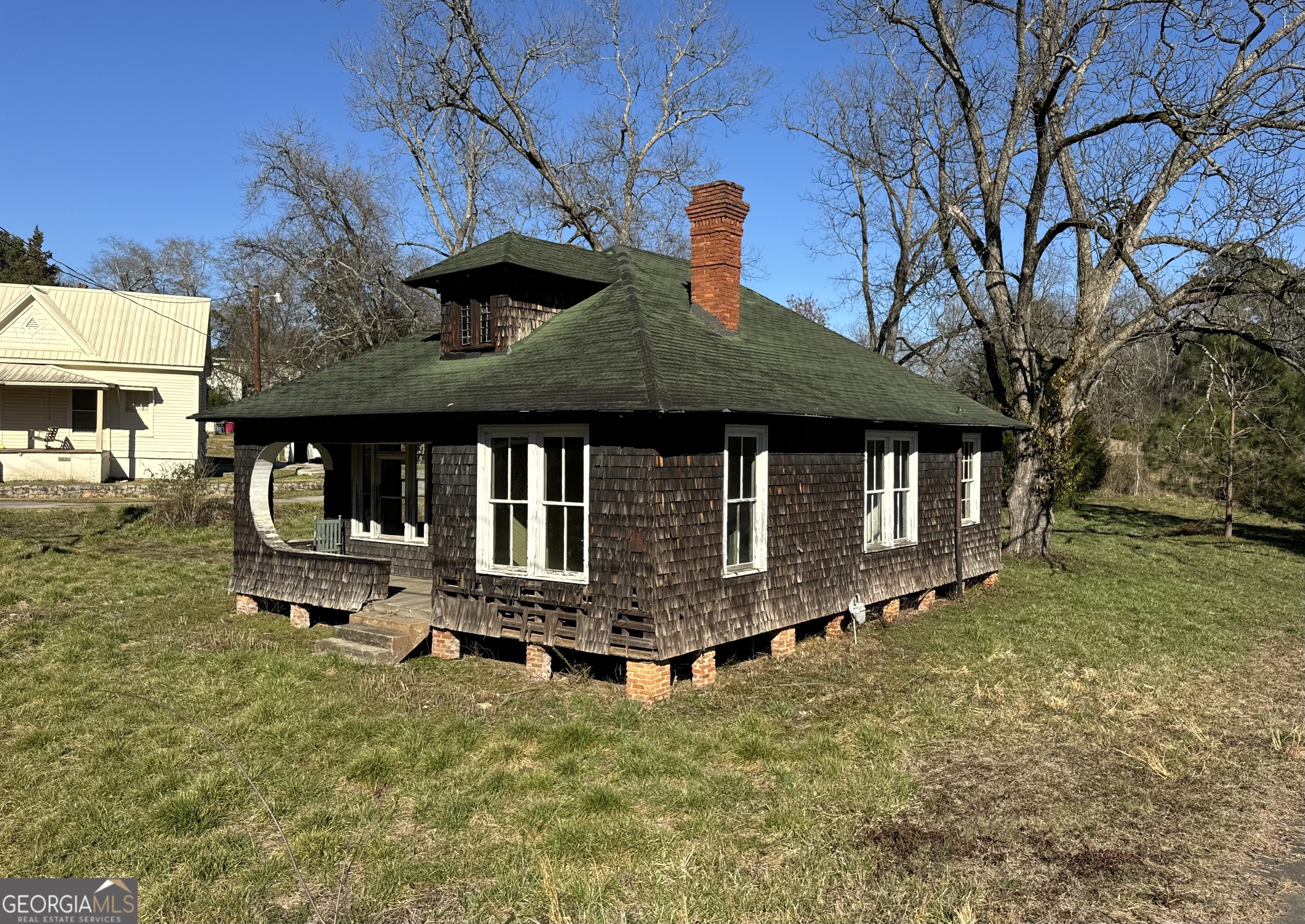 9822 Jones Street Sparta, GA 31087 - Photo 8 of 52 a front view of a house with a yard