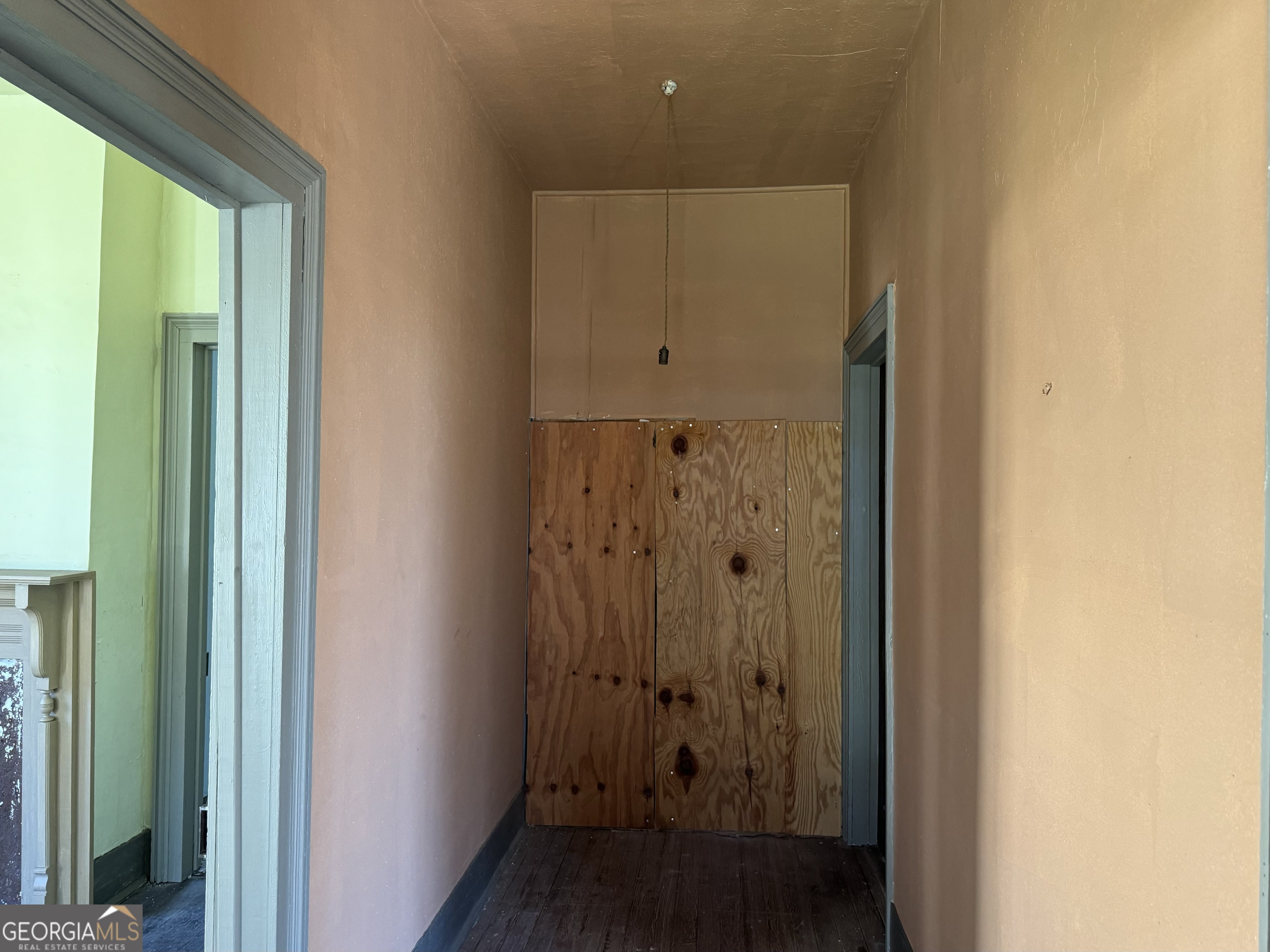 9822 Jones Street Sparta, GA 31087 - Photo 10 of 52 a view of a hallway with wooden floor