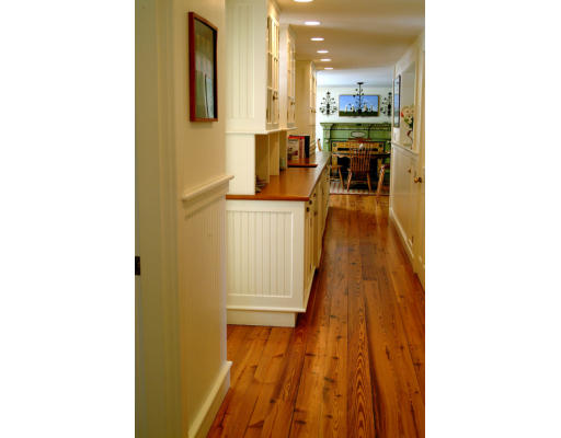 4 Claybrook Road Dover, MA 02030 - Photo 13 of 22 a view of a hallway with wooden floor and dining room