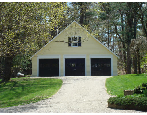 4 Claybrook Road Dover, MA 02030 - Photo 17 of 22 a front view of a house with a garden