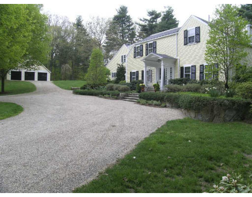 4 Claybrook Road Dover, MA 02030 - Photo 20 of 22 a front view of a house with a yard and trees