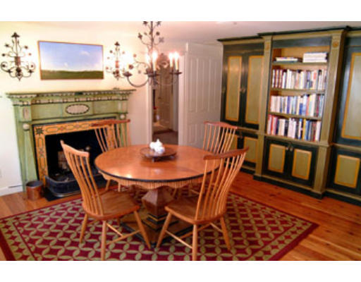 4 Claybrook Road Dover, MA 02030 - Photo 7 of 22 a dining room with furniture and a fireplace
