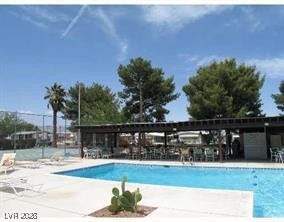 4552 Royal Ridge Avenue Las Vegas, NV 89103 - Photo 13 of 13 Community pool with a patio area