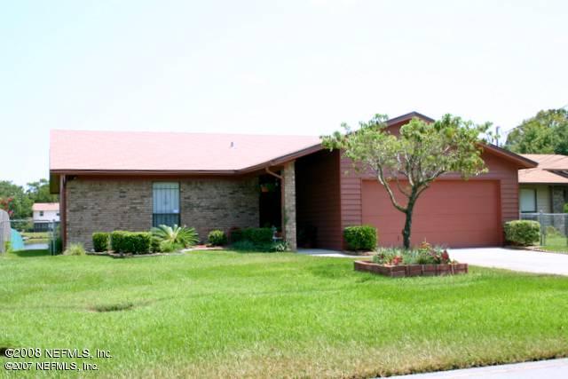 1637 Derringer Road Jacksonville, FL 32225 - Photo 1 of 11 a backyard of a house with lots of green space